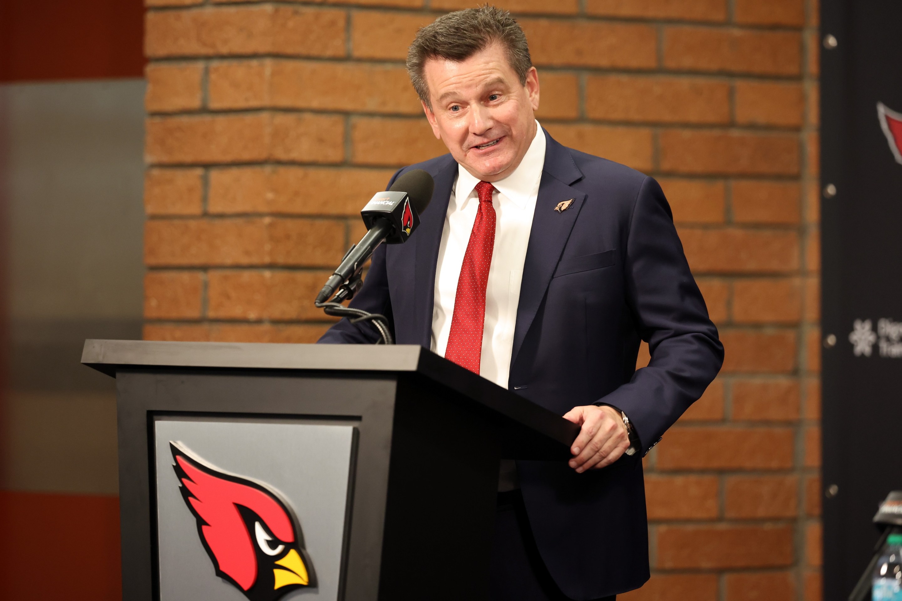 Owner Michael Bidwill of the Arizona Cardinals speaks during a press conference introducing new head coach Mike LaFleur on February 3, 2026. He's kind of making an "ehhh" face.