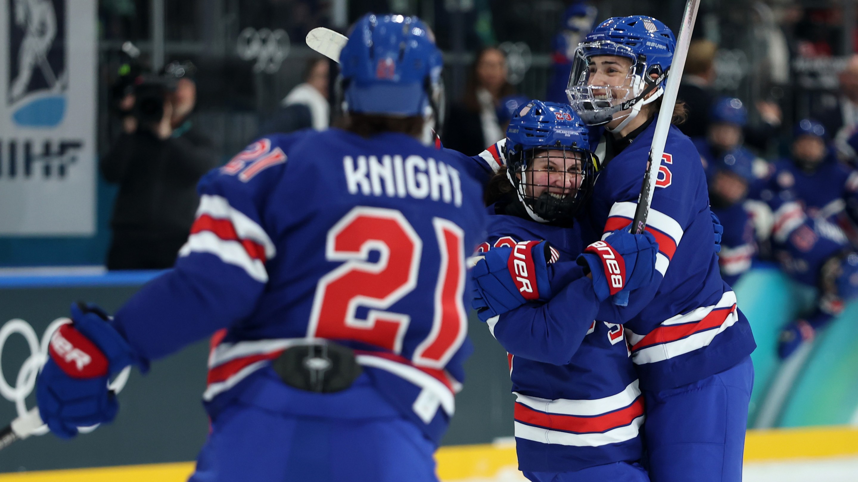 Megan Keller #5 (R) of Team United States celebrates scoring a goal with teammates Hannah Bilka #23 (C) and Hilary Knight #21 (L) in the first period during the Women's Preliminary Round Group A match between the United States and Czechia on Day minus one of the Milano Cortina 2026 Winter Olympic games at Milano Rho Ice Hockey Arena on February 05, 2026 in Milan, Italy.