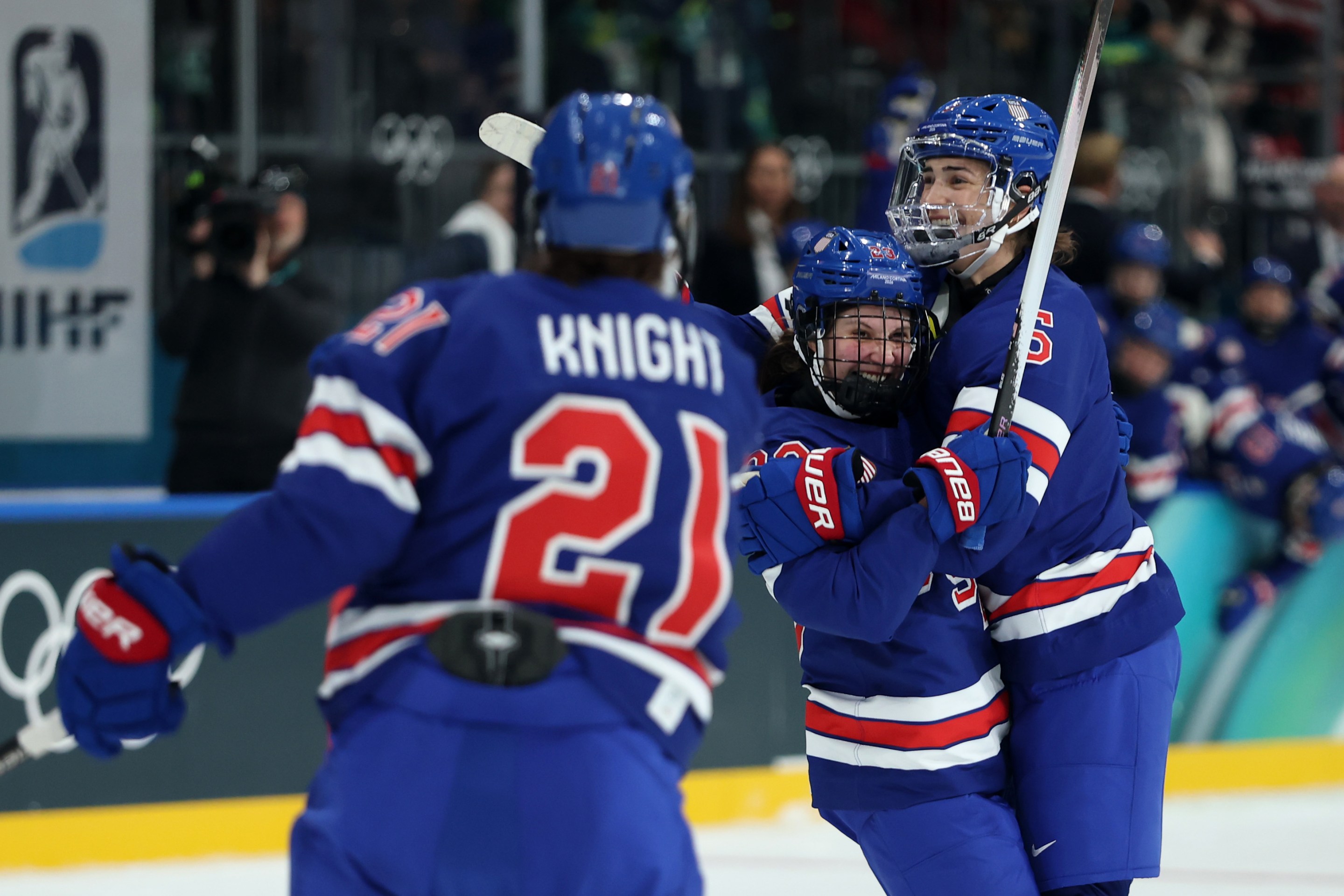 Megan Keller #5 (R) of Team United States celebrates scoring a goal with teammates Hannah Bilka #23 (C) and Hilary Knight #21 (L) in the first period during the Women's Preliminary Round Group A match between the United States and Czechia on Day minus one of the Milano Cortina 2026 Winter Olympic games at Milano Rho Ice Hockey Arena on February 05, 2026 in Milan, Italy.