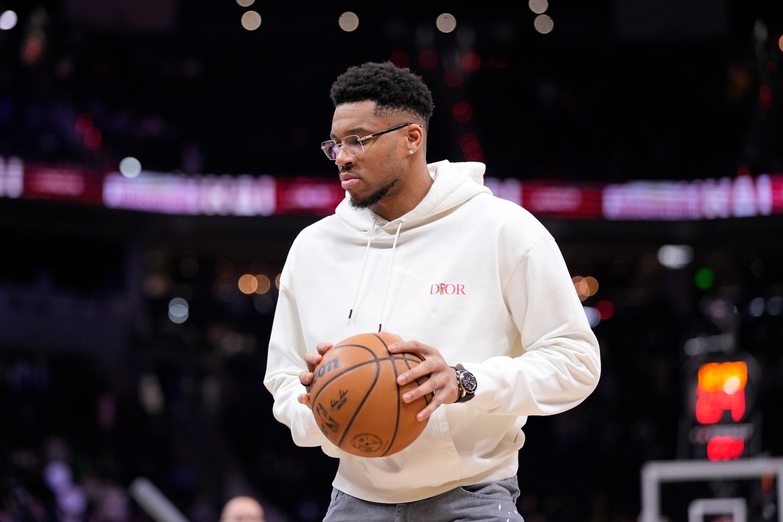Giannis in glasses and a hoodie.