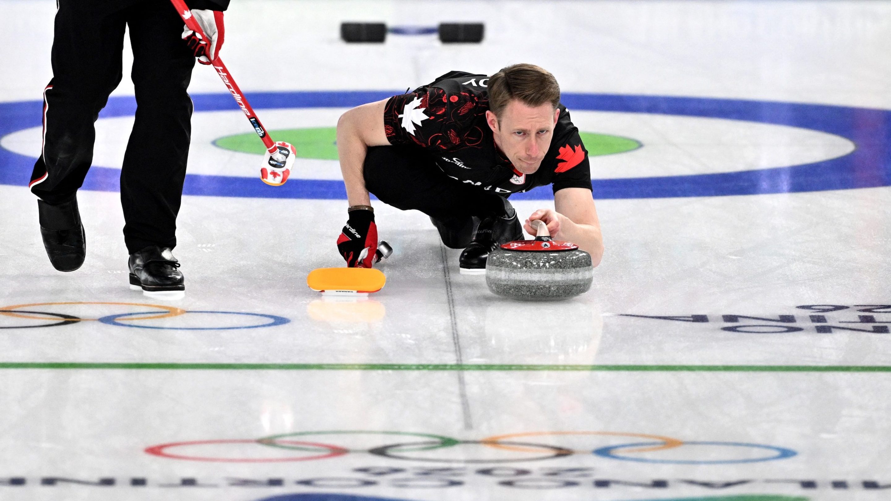 Marc Kennedy of Team Canada competes in the curling men's round robin between Canada and USA during the Milano Cortina 2026 Winter Olympic Games at the Cortina Curling Olympic Stadium in Cortina d’Ampezzo on February 13, 2026. (Photo by Tiziana FABI / AFP)