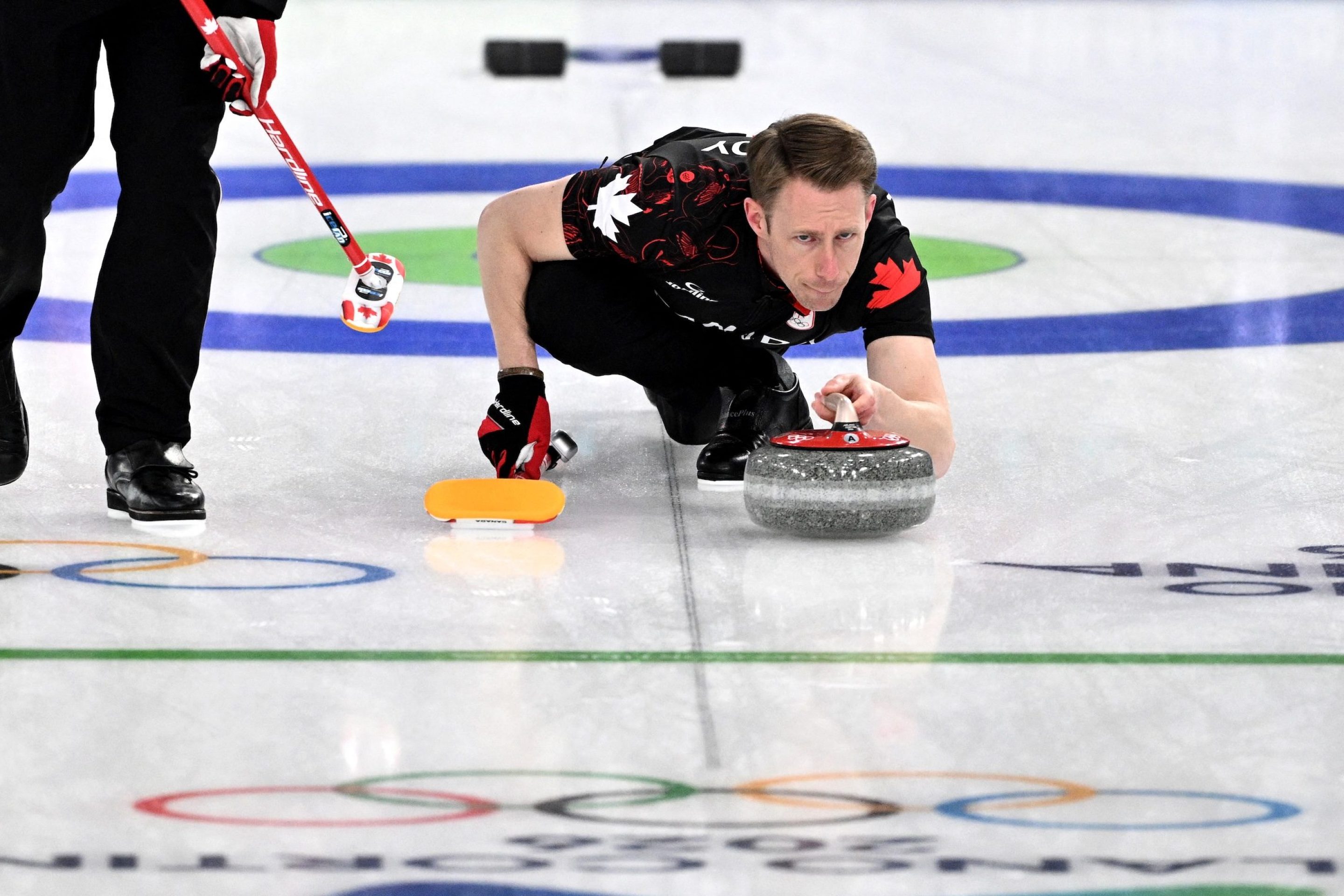 Marc Kennedy of Team Canada competes in the curling men's round robin between Canada and USA during the Milano Cortina 2026 Winter Olympic Games at the Cortina Curling Olympic Stadium in Cortina d’Ampezzo on February 13, 2026. (Photo by Tiziana FABI / AFP)