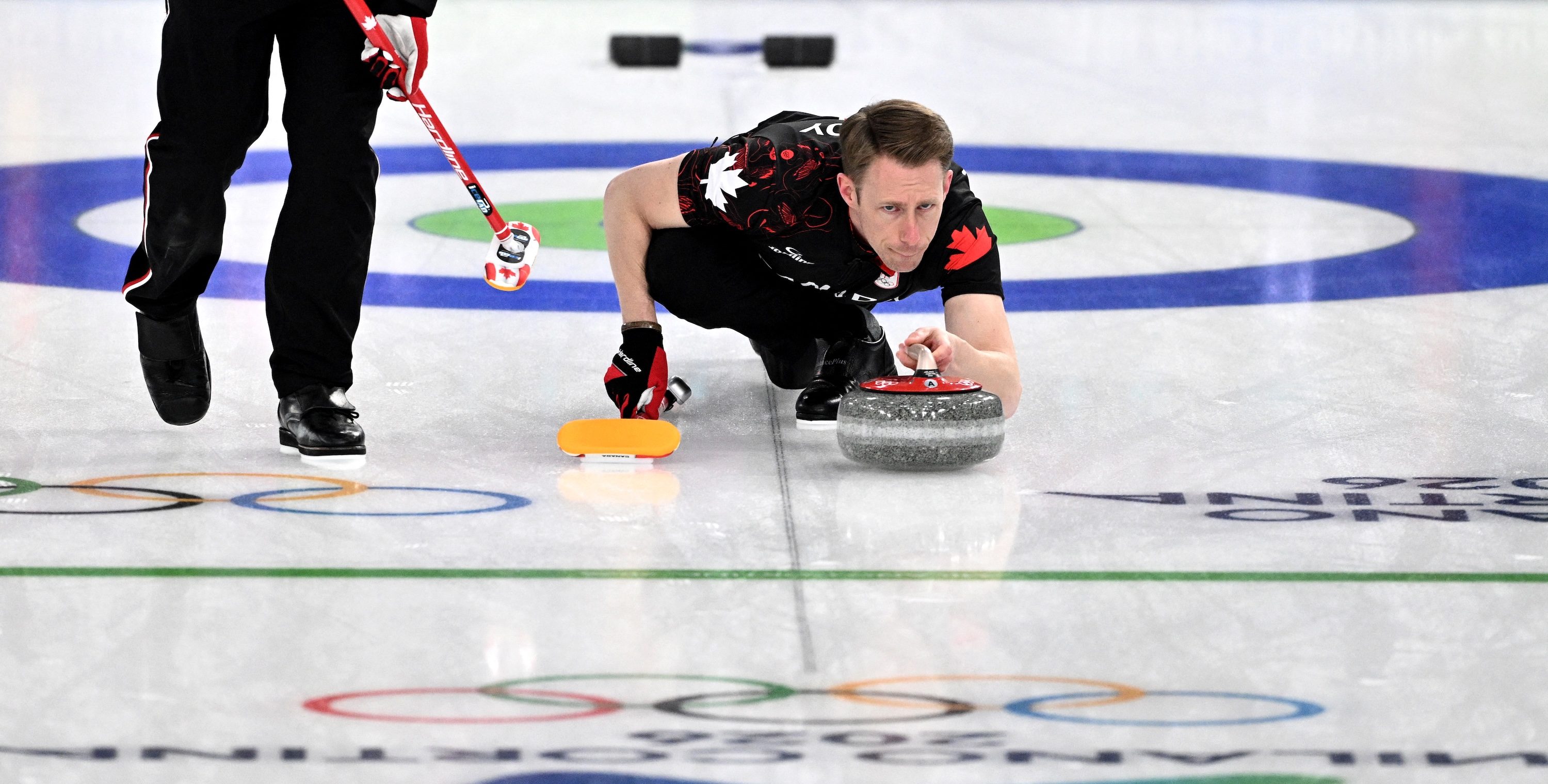 Marc Kennedy of Team Canada competes in the curling men's round robin between Canada and USA during the Milano Cortina 2026 Winter Olympic Games at the Cortina Curling Olympic Stadium in Cortina d’Ampezzo on February 13, 2026. (Photo by Tiziana FABI / AFP)