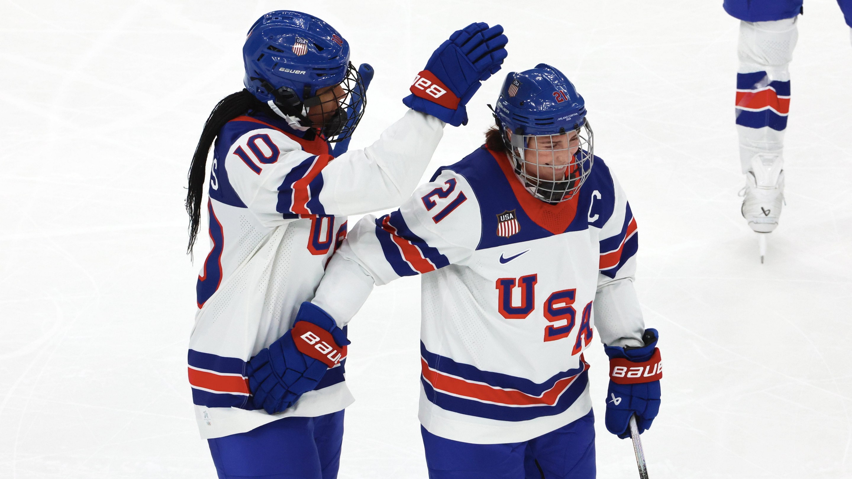 Laila Edwards #10 of Team United States celebrate her first goal with Hilary Knight #21 during the Women's Ice Hockey - Group A match between Team Canada and Team United States on day four of the Milano Cortina 2026 Winter Olympic games at Milano Santagiulia Ice Hockey Arena on February 10, 2026 in Milan, Italy.