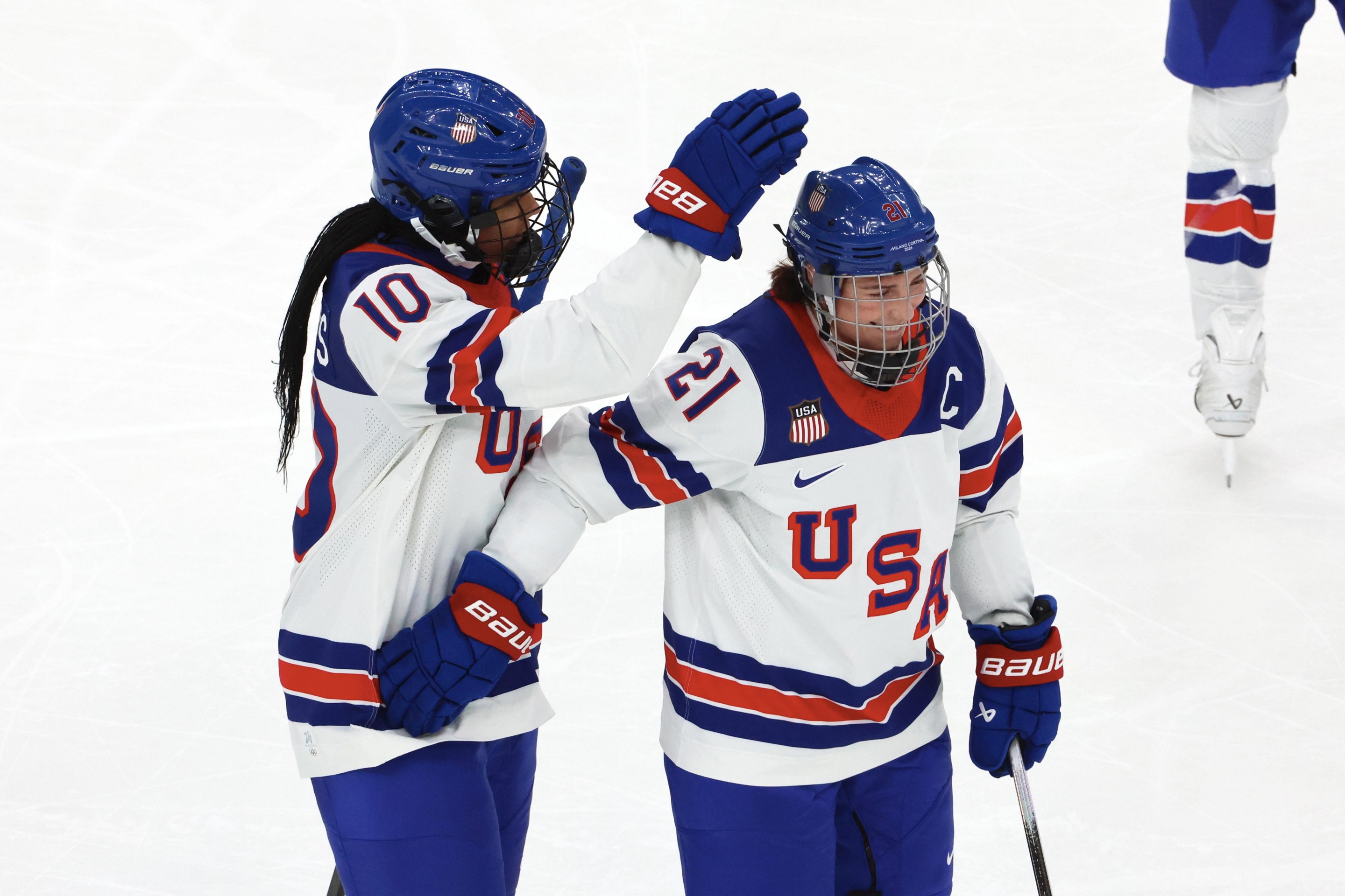 Laila Edwards #10 of Team United States celebrate her first goal with Hilary Knight #21 during the Women's Ice Hockey - Group A match between Team Canada and Team United States on day four of the Milano Cortina 2026 Winter Olympic games at Milano Santagiulia Ice Hockey Arena on February 10, 2026 in Milan, Italy.