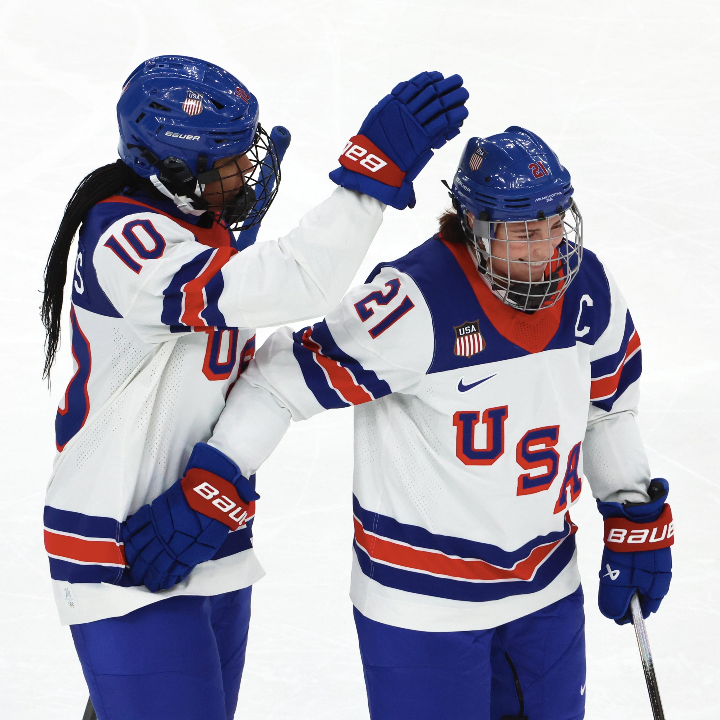 Laila Edwards #10 of Team United States celebrate her first goal with Hilary Knight #21 during the Women's Ice Hockey - Group A match between Team Canada and Team United States on day four of the Milano Cortina 2026 Winter Olympic games at Milano Santagiulia Ice Hockey Arena on February 10, 2026 in Milan, Italy.