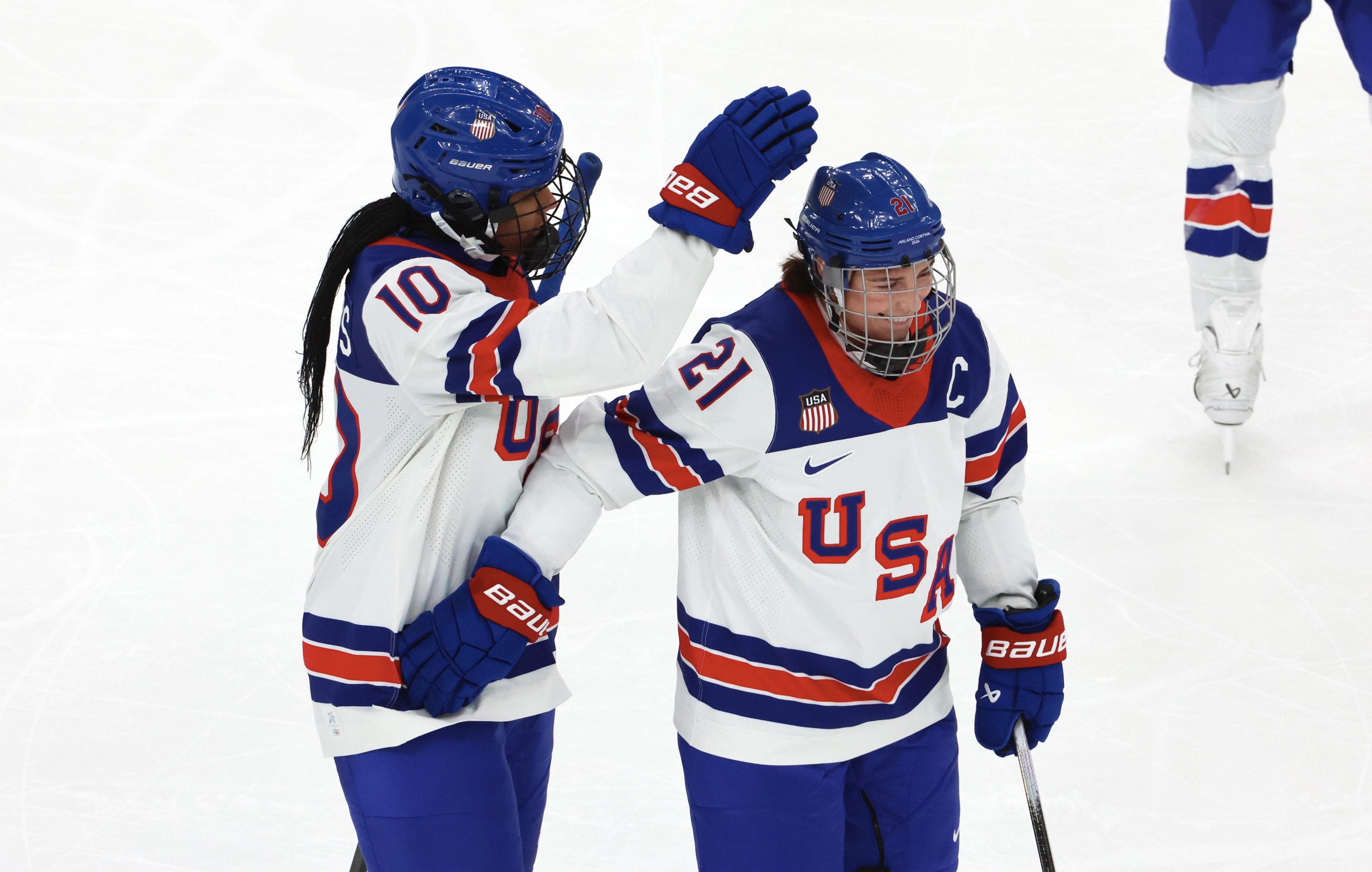 Laila Edwards #10 of Team United States celebrate her first goal with Hilary Knight #21 during the Women's Ice Hockey - Group A match between Team Canada and Team United States on day four of the Milano Cortina 2026 Winter Olympic games at Milano Santagiulia Ice Hockey Arena on February 10, 2026 in Milan, Italy.