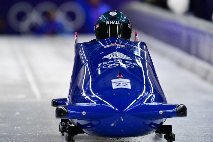 Britain's Brad Hall pilots in the bobsleigh men's 2-man training session at Cortina Sliding Centre during the Milano Cortina 2026 Winter Olympic Games in Cortina d'Ampezzo on February 14, 2026. (Photo by