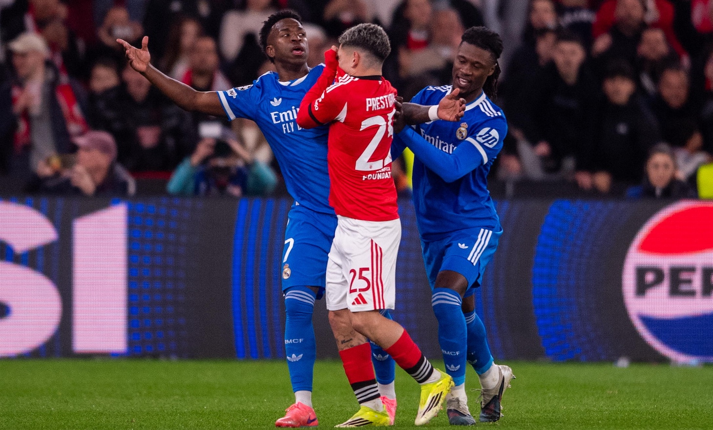 Gianluca Prestianni of SL Benfica seems with Vinicius Junior of Real Madrid CF during the UEFA Champions League 2025/26 League Knockout Play-off First Leg match between SL Benfica and Real Madrid C.F. at Estadio do SL Benfica on February 17, 2026 in Lisbon, Portugal.