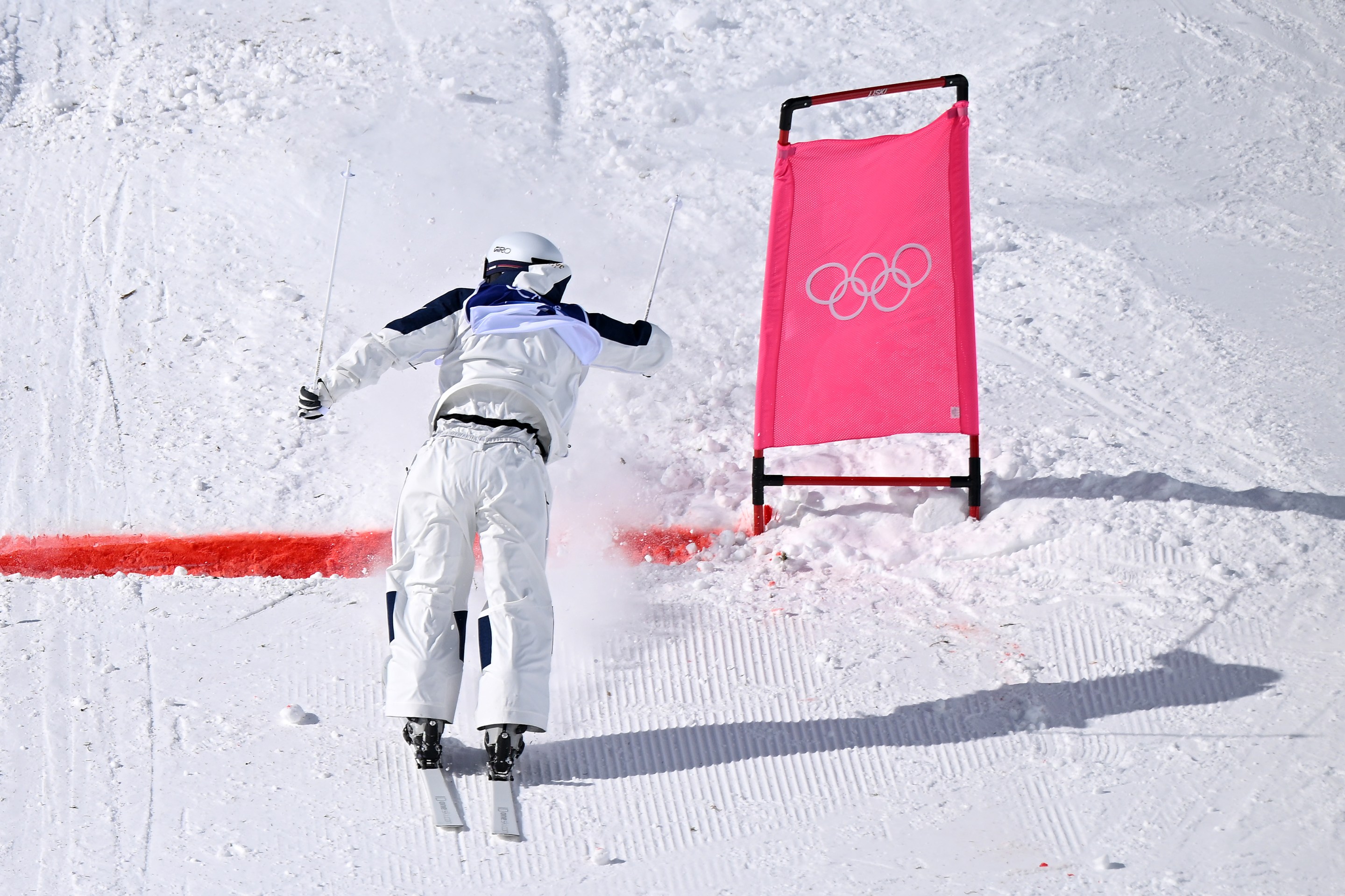 LIVIGNO, ITALY - FEBRUARY 15: Ikuma Horishima of Team Japan crosses the finish line backwards after a fall as he competes in the Men's Dual Moguls 1/8 Finals against Nick Page of Team United States (not pictured) on day nine of the Milano Cortina 2026 Winter Olympic games at Livigno Air Park on February 15, 2026 in Livigno, Italy. (Photo by Hannah Peters/Getty Images)