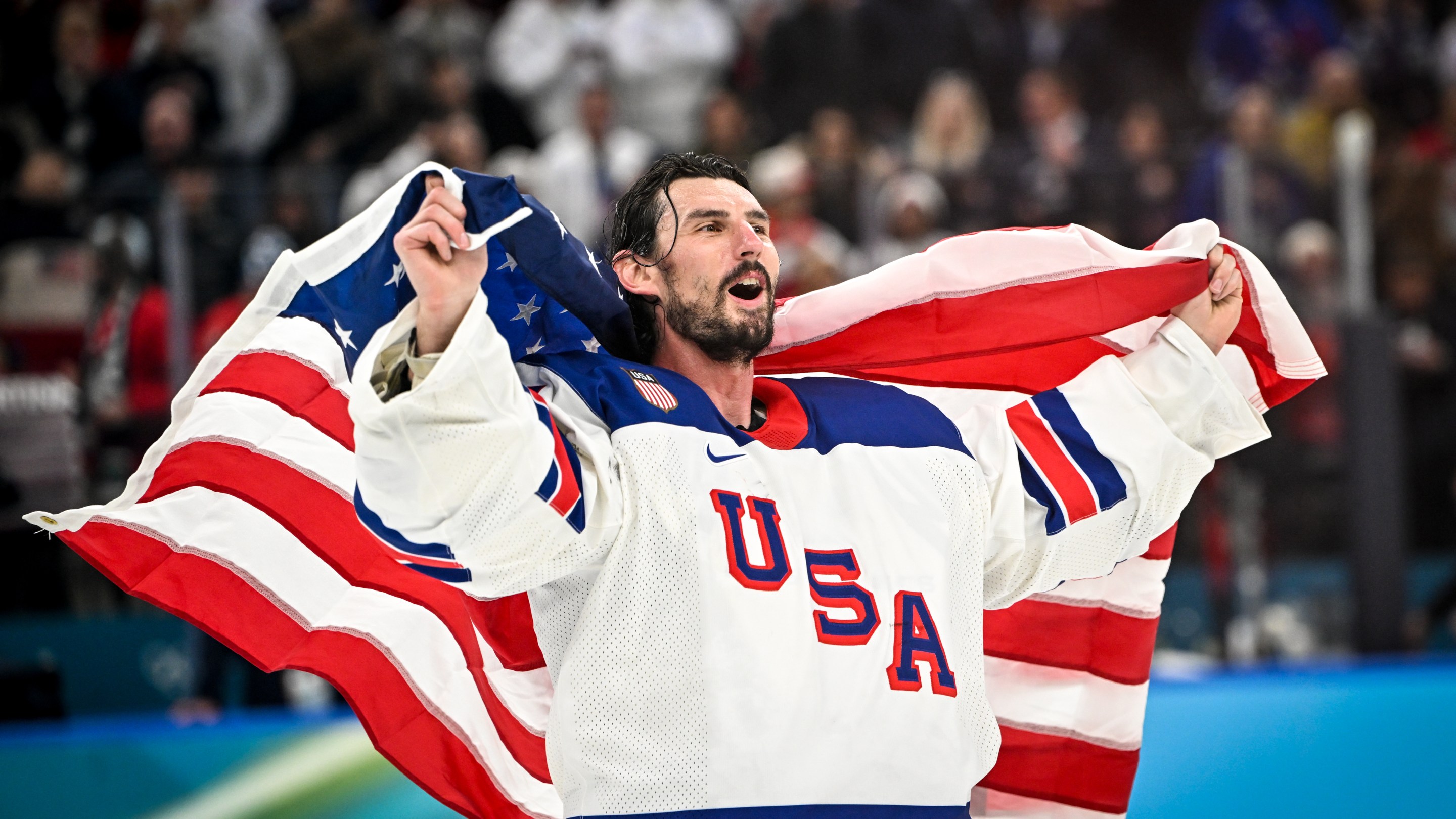 MILAN, ITALY - FEBRUARY 22: goalkeeper Connor Hellebuyck of United States celebrates winning the gold medal during the Ice Hockey Men's Gold Medal Game match between Canada and USA on day sixteen of the Milano Cortina 2026 Winter Olympic games at Milano Santagiulia Ice Hockey Arena on February 22, 2026 in Milan, Italy. (Photo by Andrea Branca/Eurasia Sport Images/Getty Images)