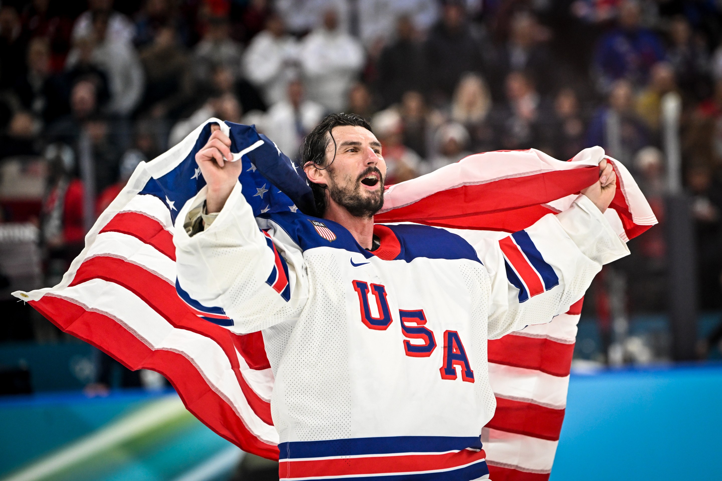 MILAN, ITALY - FEBRUARY 22: goalkeeper Connor Hellebuyck of United States celebrates winning the gold medal during the Ice Hockey Men's Gold Medal Game match between Canada and USA on day sixteen of the Milano Cortina 2026 Winter Olympic games at Milano Santagiulia Ice Hockey Arena on February 22, 2026 in Milan, Italy. (Photo by Andrea Branca/Eurasia Sport Images/Getty Images)