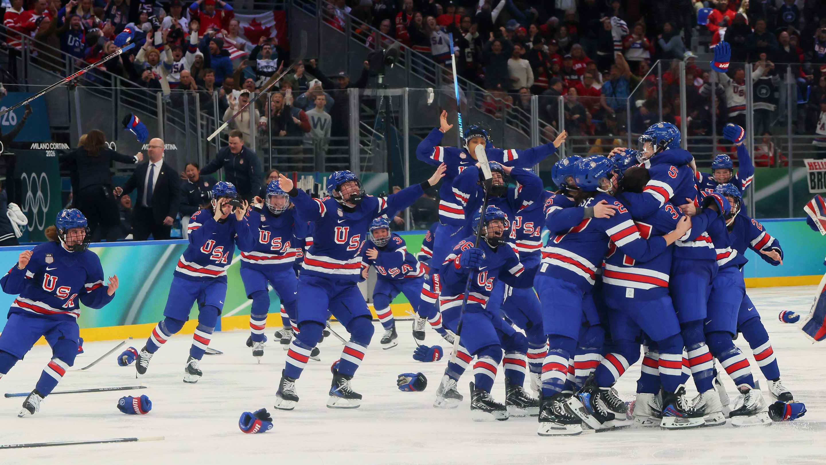 MILAN, ITALY - FEBRUARY 19: Megan Keller #5 of Team United States celebrates with teammates after scoring the game-winning goal to win the gold medals in the overtime during the Women's Gold Medal match between the United States and Canada on day 13 of the Milano Cortina 2026 Winter Olympic games at Milano Santagiulia Ice Hockey Arena on February 19, 2026 in Milan, Italy. (Photo by Bruce Bennett/Getty Images)