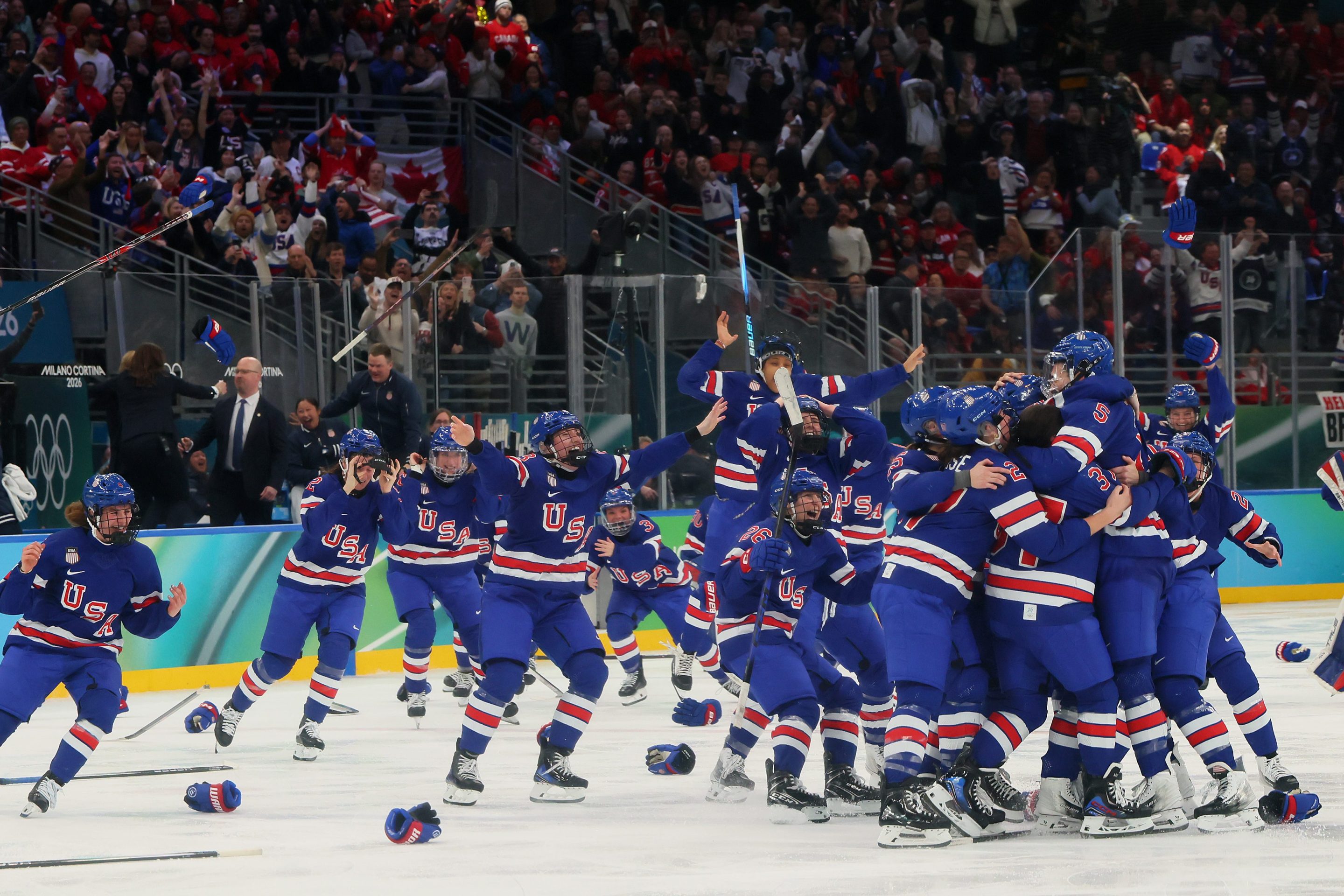 MILAN, ITALY - FEBRUARY 19: Megan Keller #5 of Team United States celebrates with teammates after scoring the game-winning goal to win the gold medals in the overtime during the Women's Gold Medal match between the United States and Canada on day 13 of the Milano Cortina 2026 Winter Olympic games at Milano Santagiulia Ice Hockey Arena on February 19, 2026 in Milan, Italy. (Photo by Bruce Bennett/Getty Images)