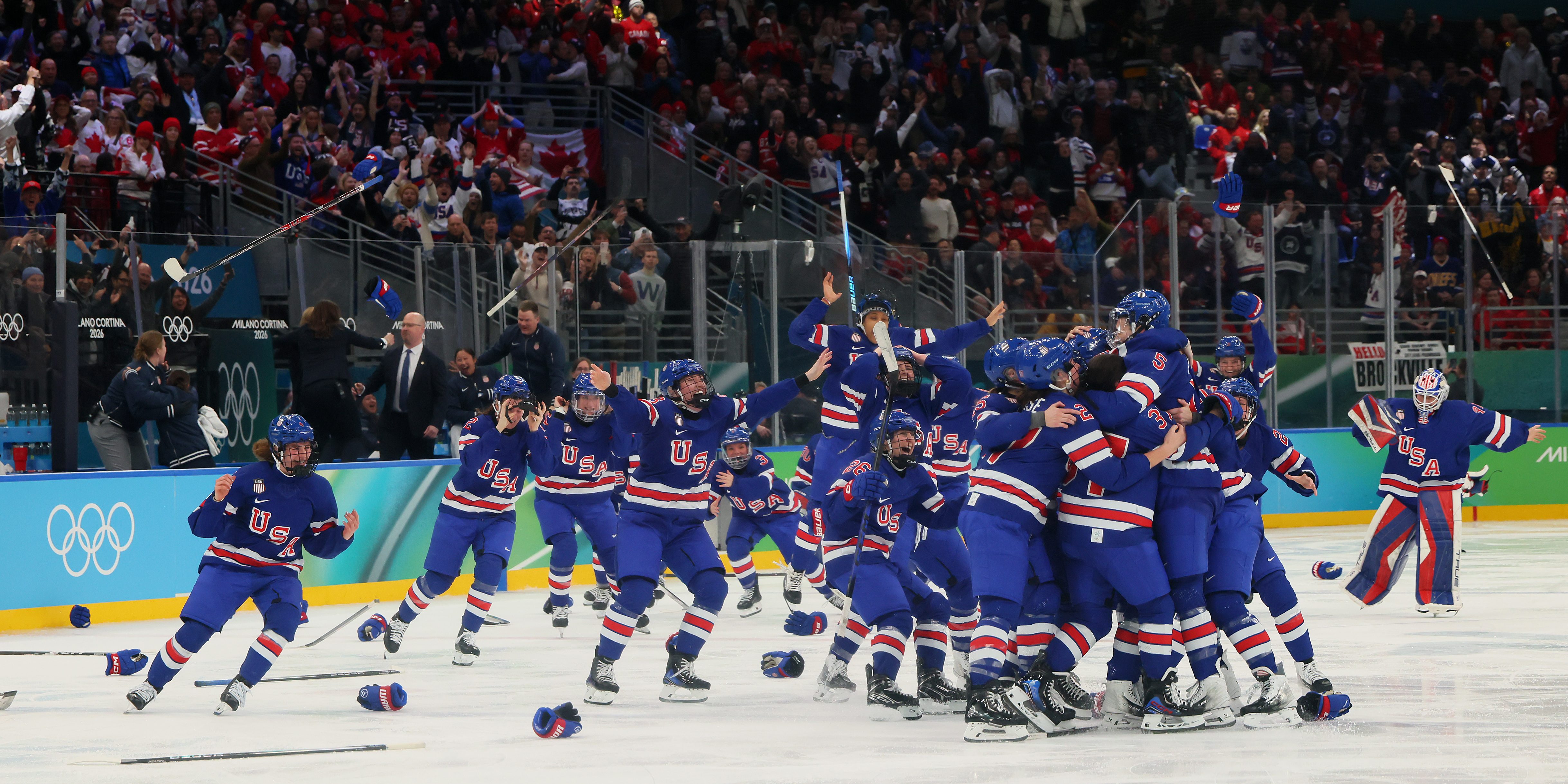 MILAN, ITALY - FEBRUARY 19: Megan Keller #5 of Team United States celebrates with teammates after scoring the game-winning goal to win the gold medals in the overtime during the Women's Gold Medal match between the United States and Canada on day 13 of the Milano Cortina 2026 Winter Olympic games at Milano Santagiulia Ice Hockey Arena on February 19, 2026 in Milan, Italy. (Photo by Bruce Bennett/Getty Images)