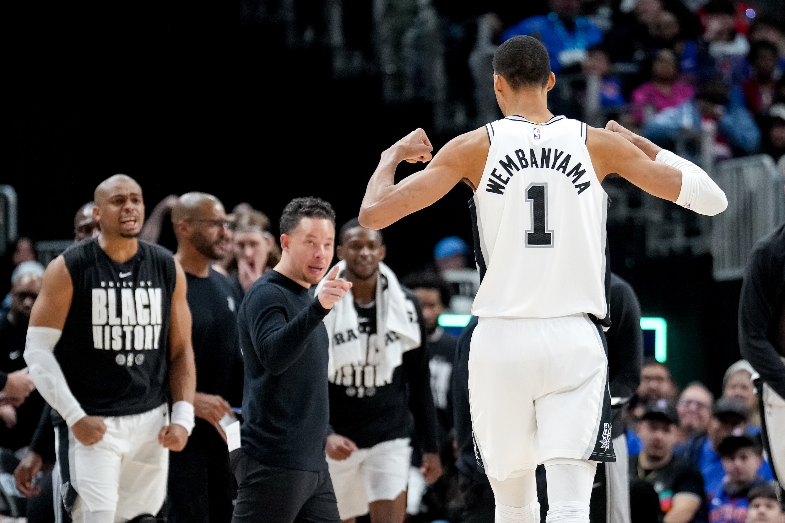 Victor Wembanyama celebrates while headed to the bench.