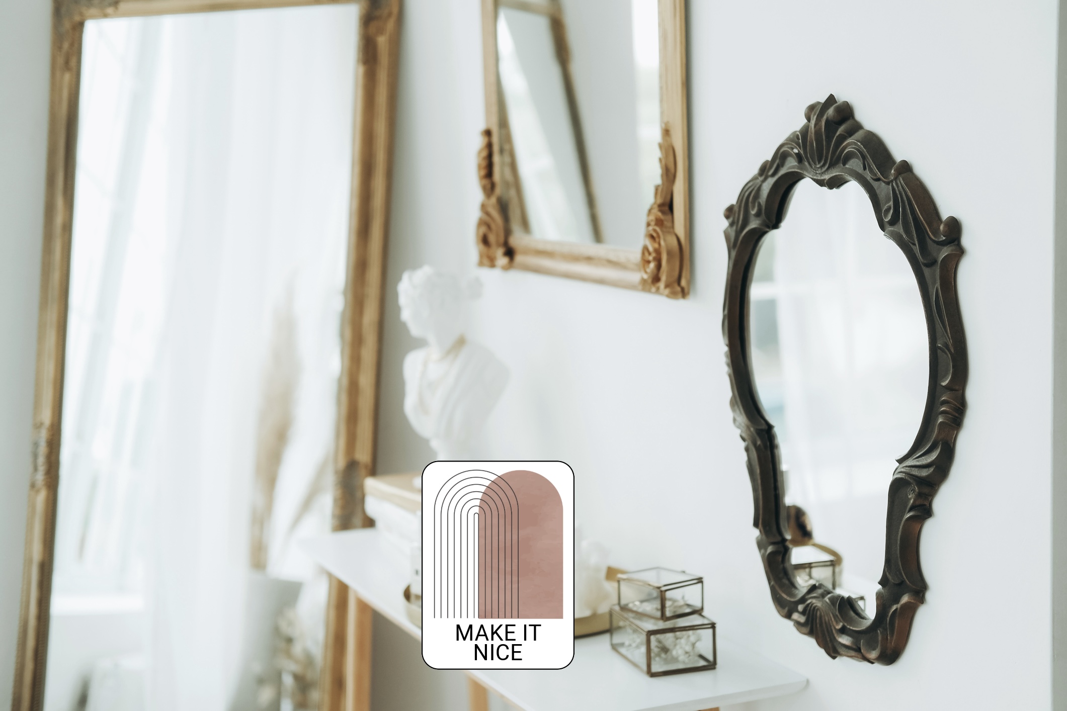 Three mirrors in vintage frames above console table with lots of decoration stuff in bright room.