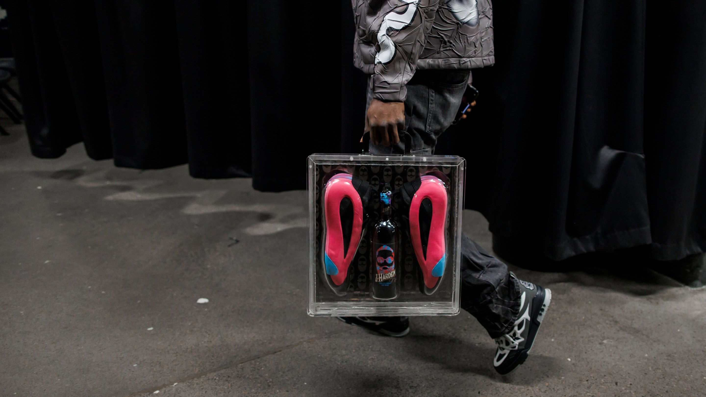 James Harden of the LA Clippers carries his brand name wine J-Harden Cabernet Sauvignon and shoe package as he arrives ahead of their NBA game against the Toronto Raptors.