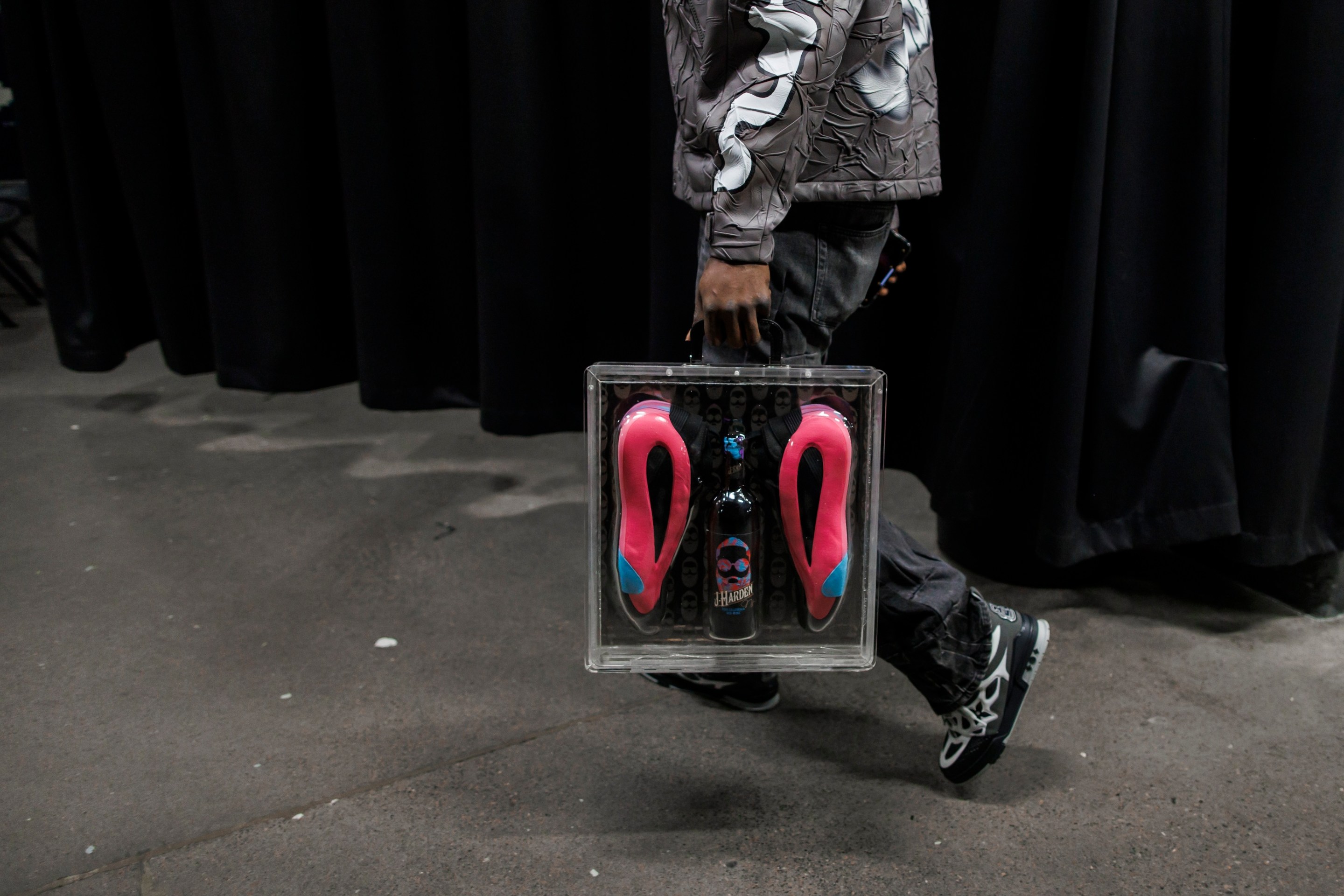 James Harden of the LA Clippers carries his brand name wine J-Harden Cabernet Sauvignon and shoe package as he arrives ahead of their NBA game against the Toronto Raptors.