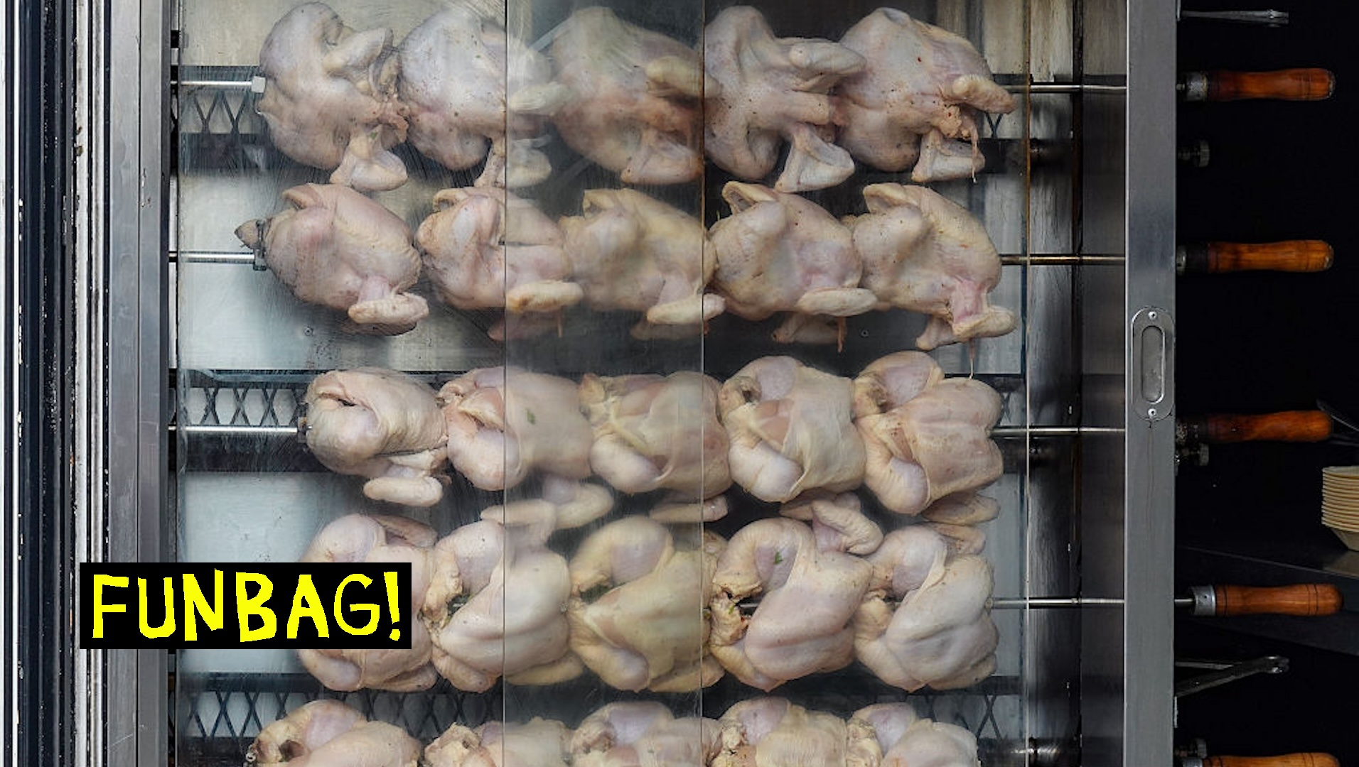 Rows of raw rotisserie chickens