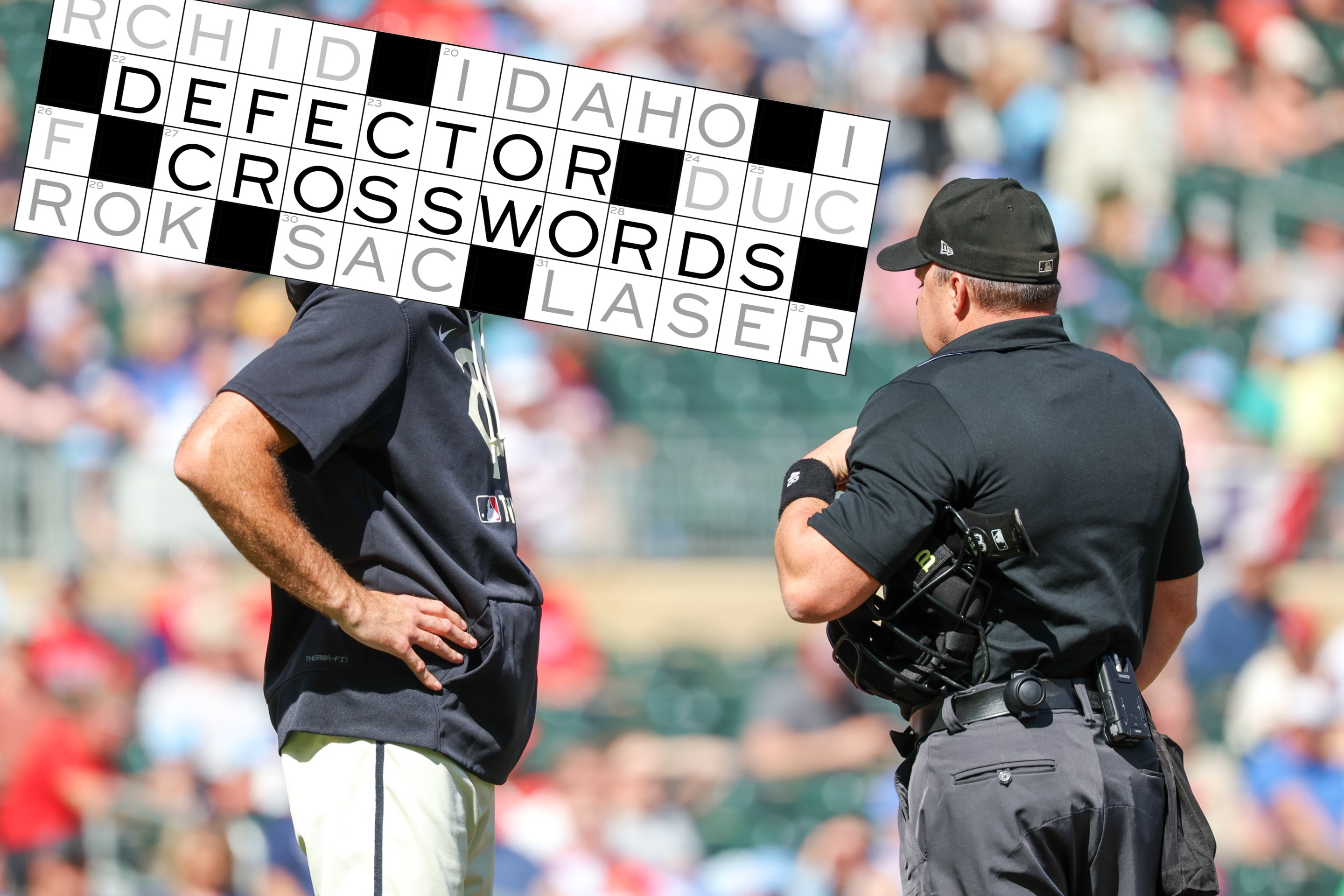 Manager Rocco Baldelli #5 of the Minnesota Twins talks to home plate umpire Nick Mahrley #48 in the first inning at Target Field on September 21, 2025 in Minneapolis, Minnesota.