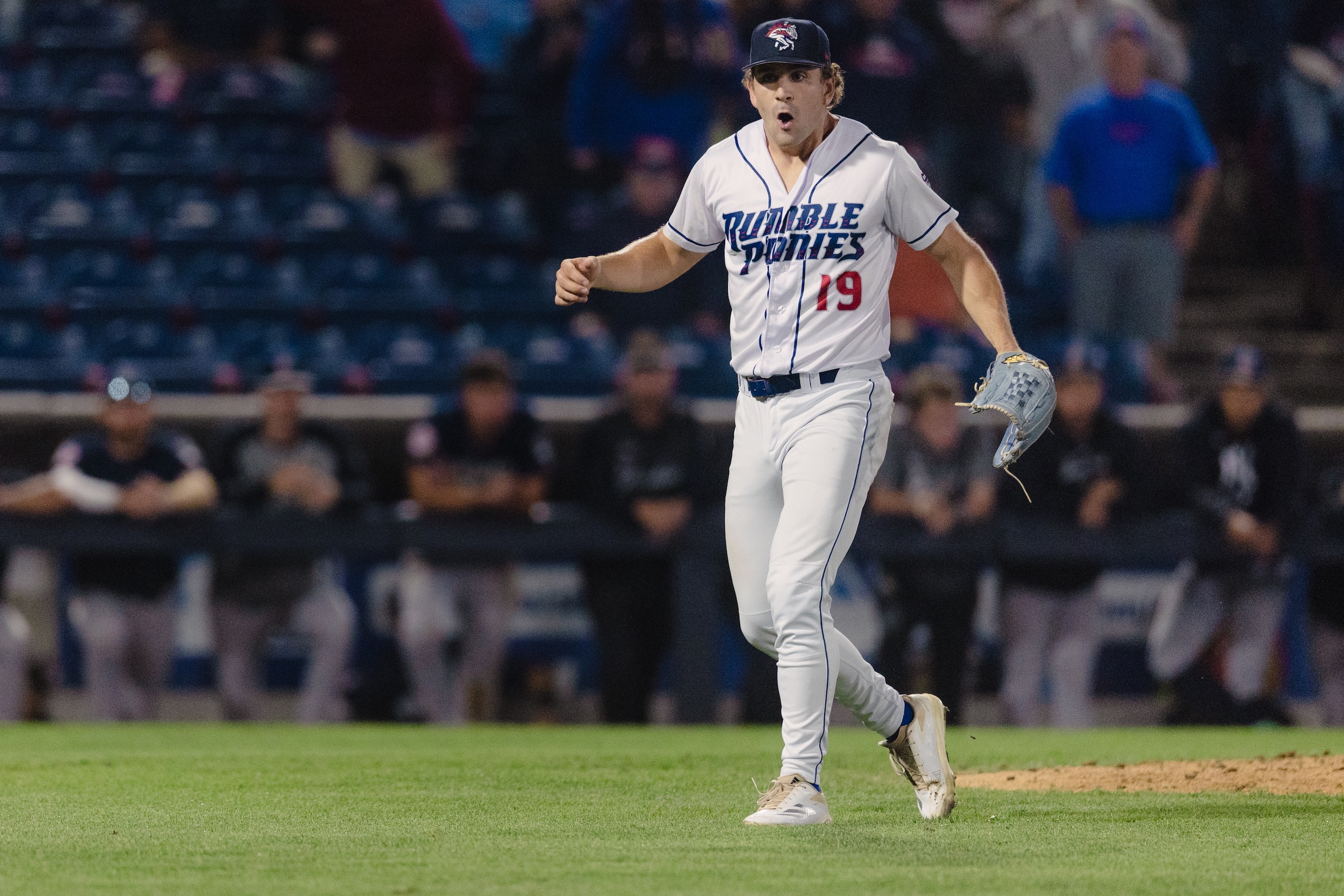 Ryan Lambert looks happy coming off the mound in a minor league game.