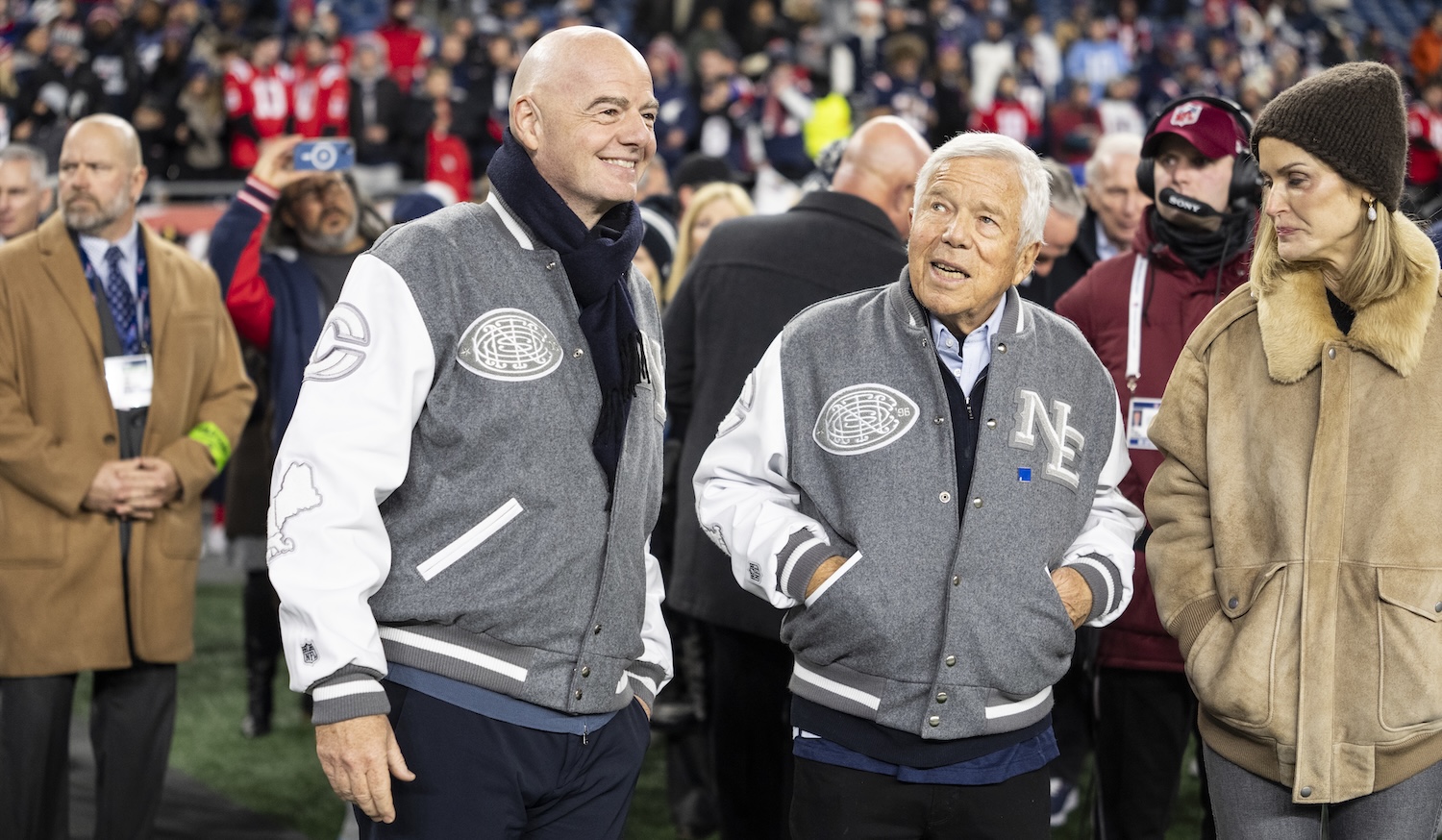 FOXBOROUGH, MASSACHUSETTS - JANUARY 11: FIFA President Gianni Infantino and Owner Robert Kraft of the New England Patriots react on the sideline prior to an NFL wild card playoff game between the Los Angeles Chargers and New England Patriots at Gillette Stadium on January 11, 2026 in Foxborough, Massachusetts. (Photo by Michael Owens/Getty Images)