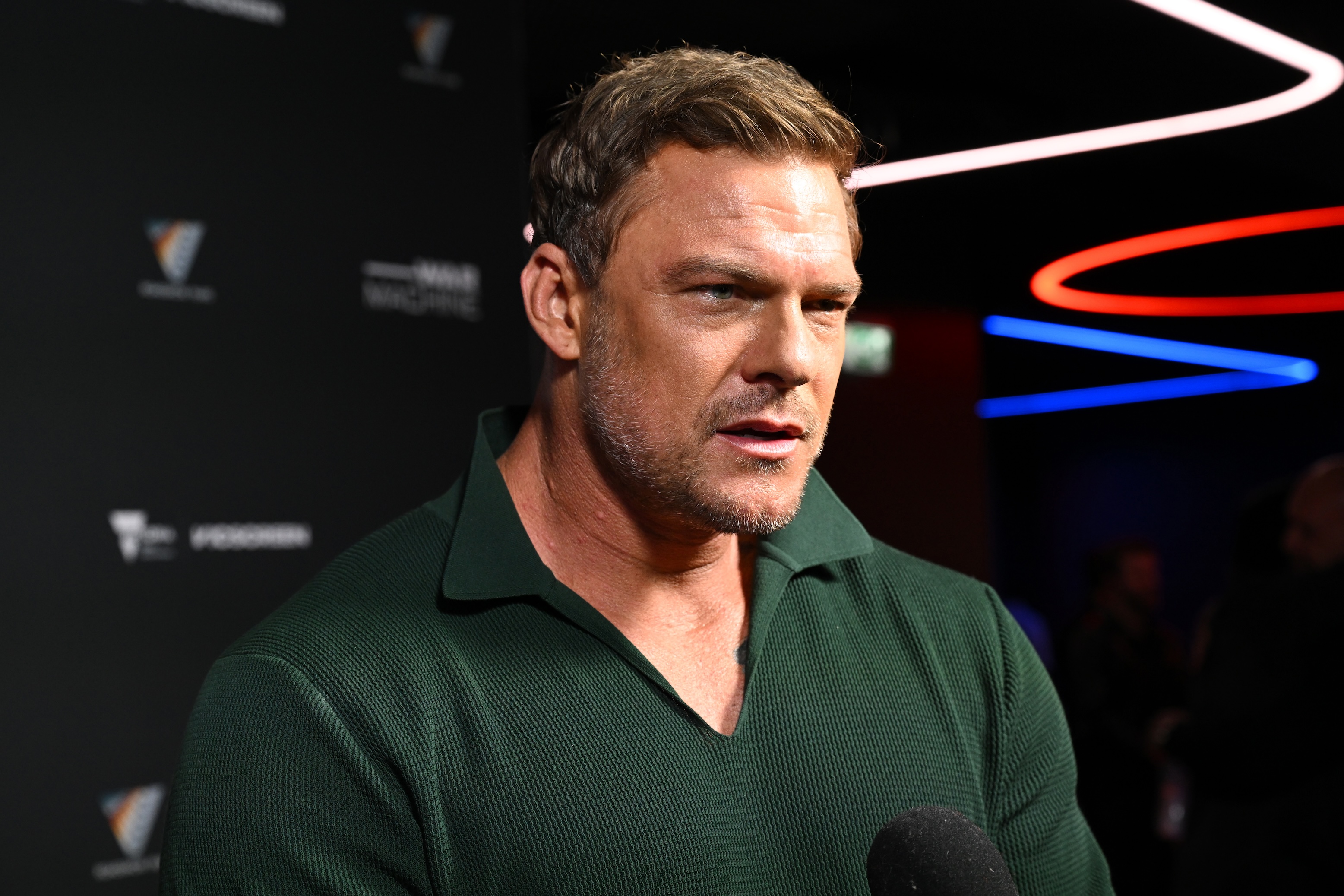 Alan Ritchson attends the "War Machine" Australian Premiere at HOYTS Melbourne Central in Ferburary of 2026.