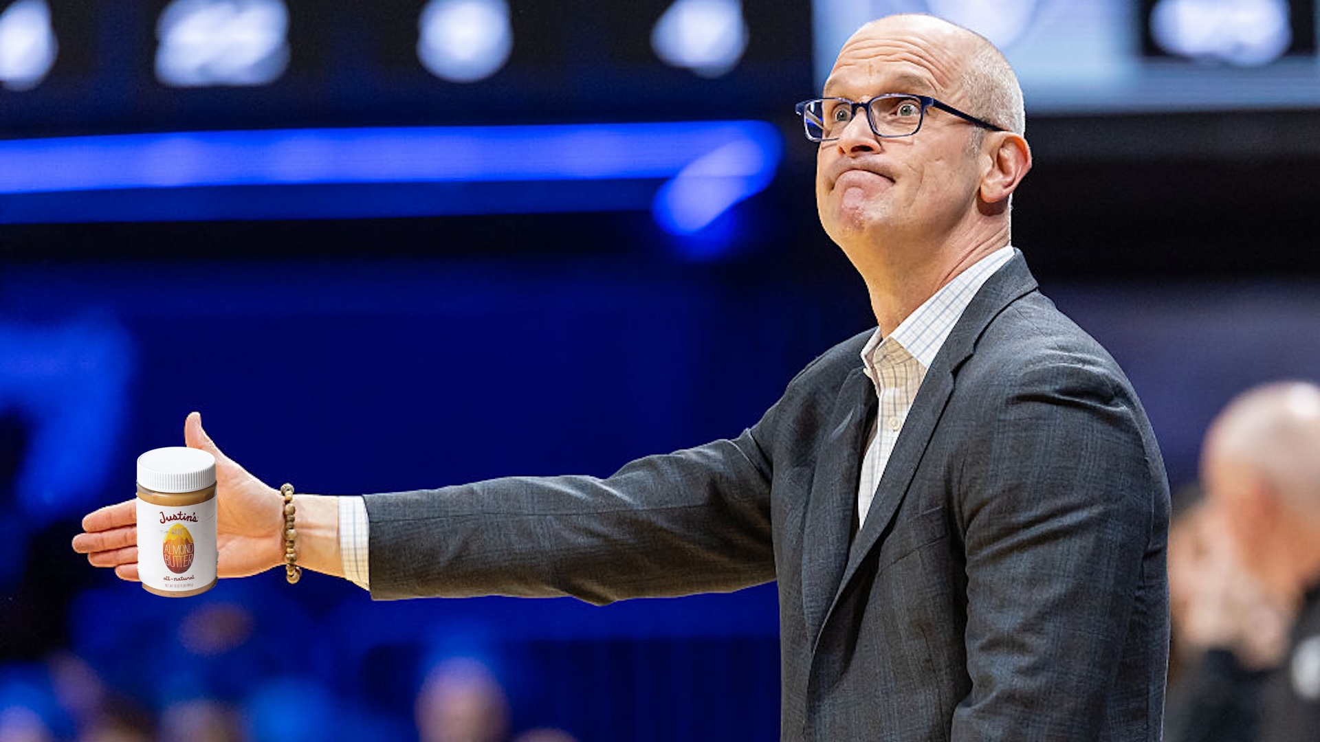 Dan Hurley holding a little jar of almond butter