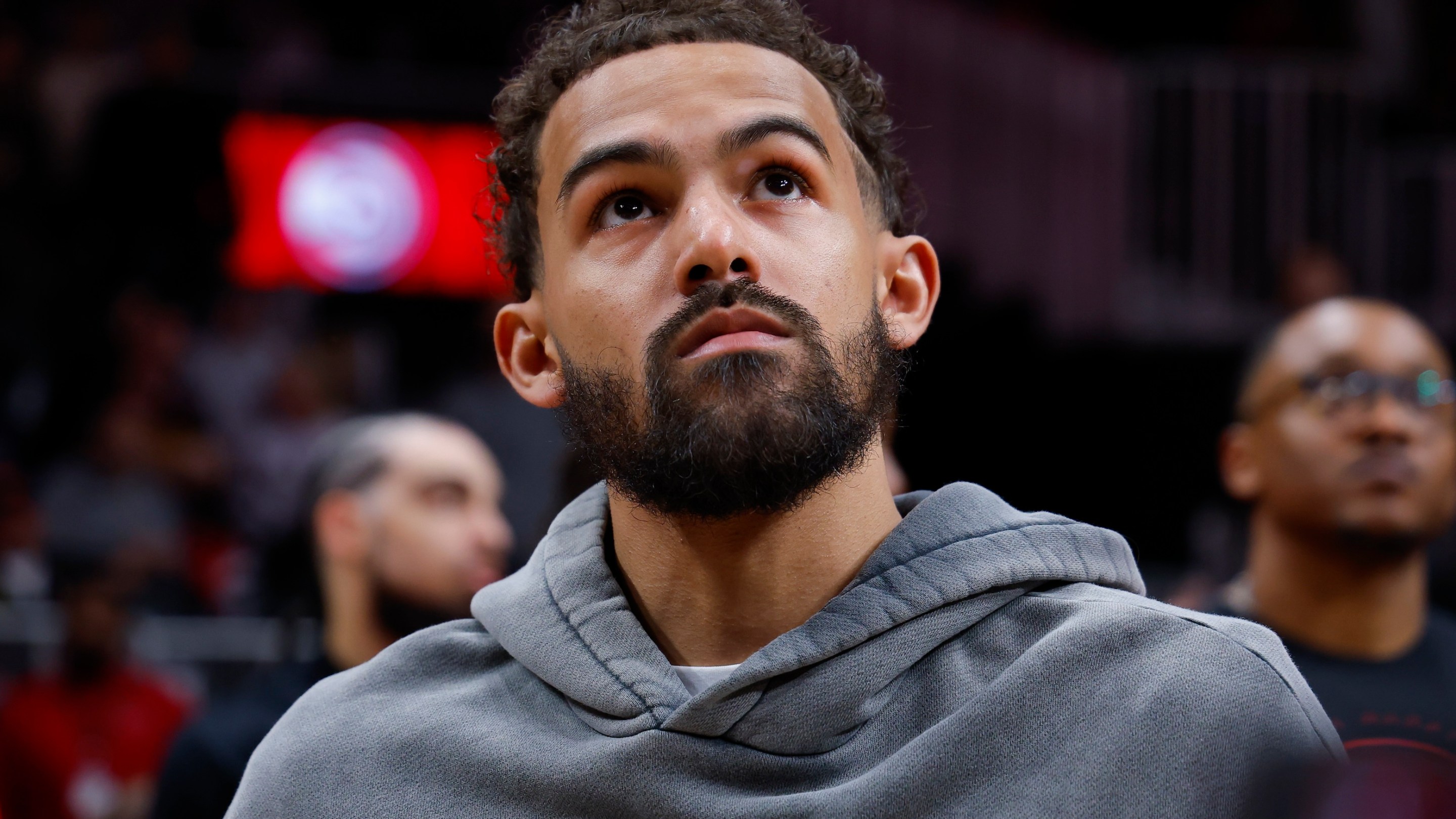 Trae Young of the Washington Wizards looks on as a tribute was shown during the second quarter against the Atlanta Hawks at State Farm Arena on February 24, 2026.