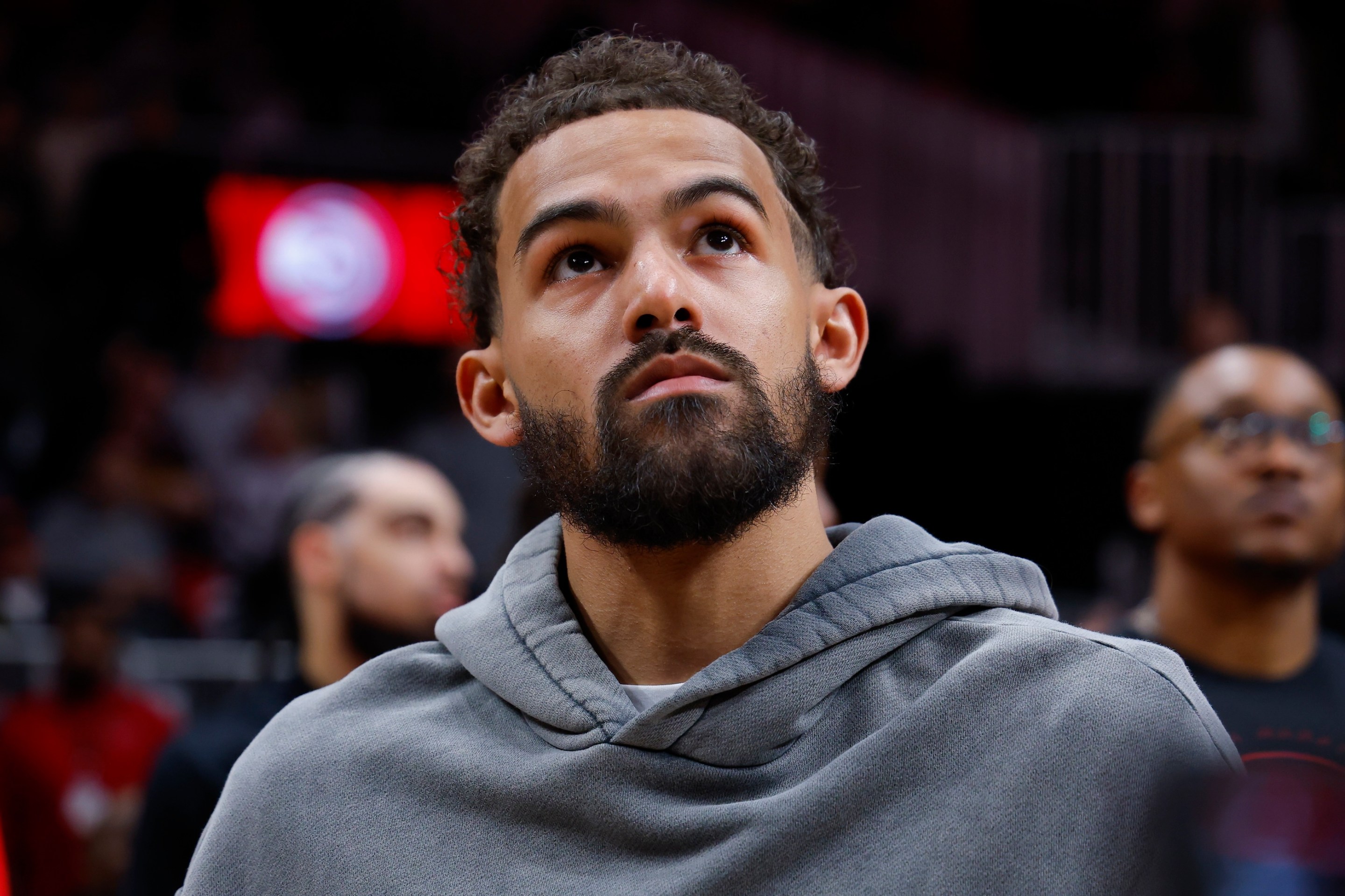 Trae Young of the Washington Wizards looks on as a tribute was shown during the second quarter against the Atlanta Hawks at State Farm Arena on February 24, 2026.