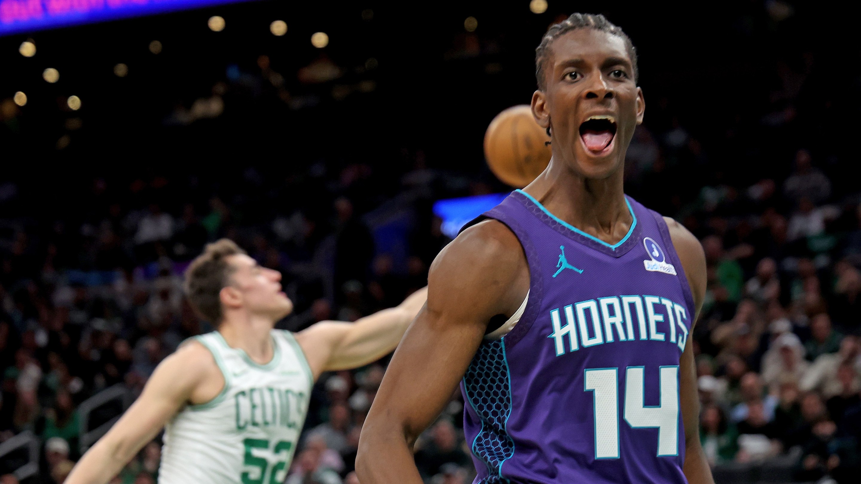 Charlotte Hornets forward Moussa Diabate (14) screams out after dunking during the first half of a NBA game at the TD Garden.