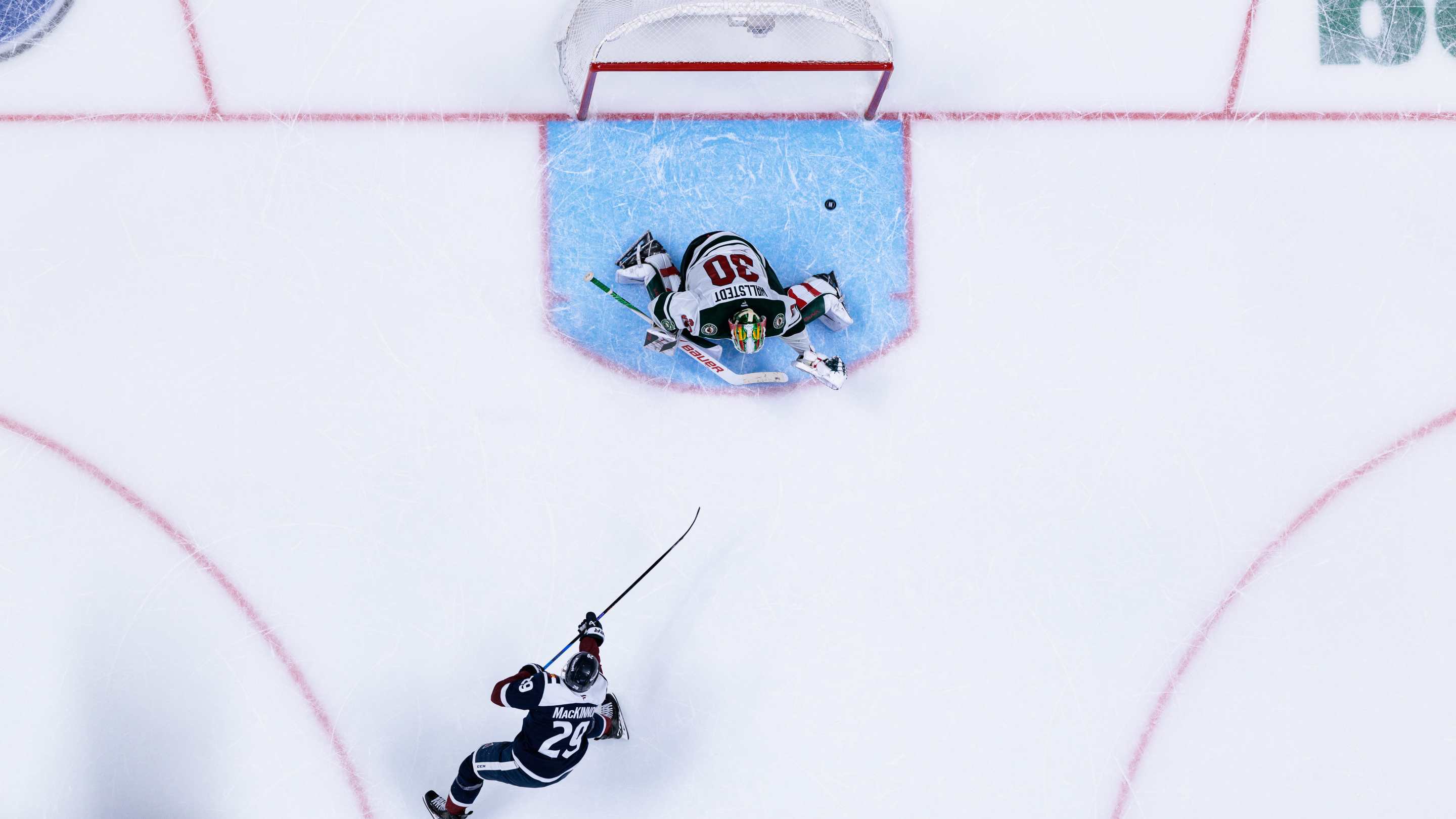 Nathan MacKinnon #29 of the Colorado Avalanche scores a goal during a shootout after overtime to win the game against the Minnesota Wild