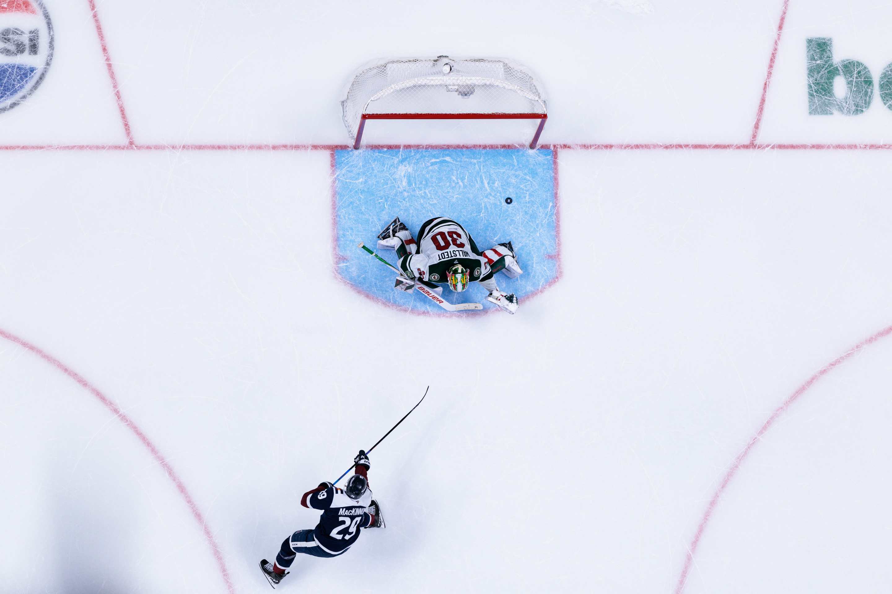 Nathan MacKinnon #29 of the Colorado Avalanche scores a goal during a shootout after overtime to win the game against the Minnesota Wild