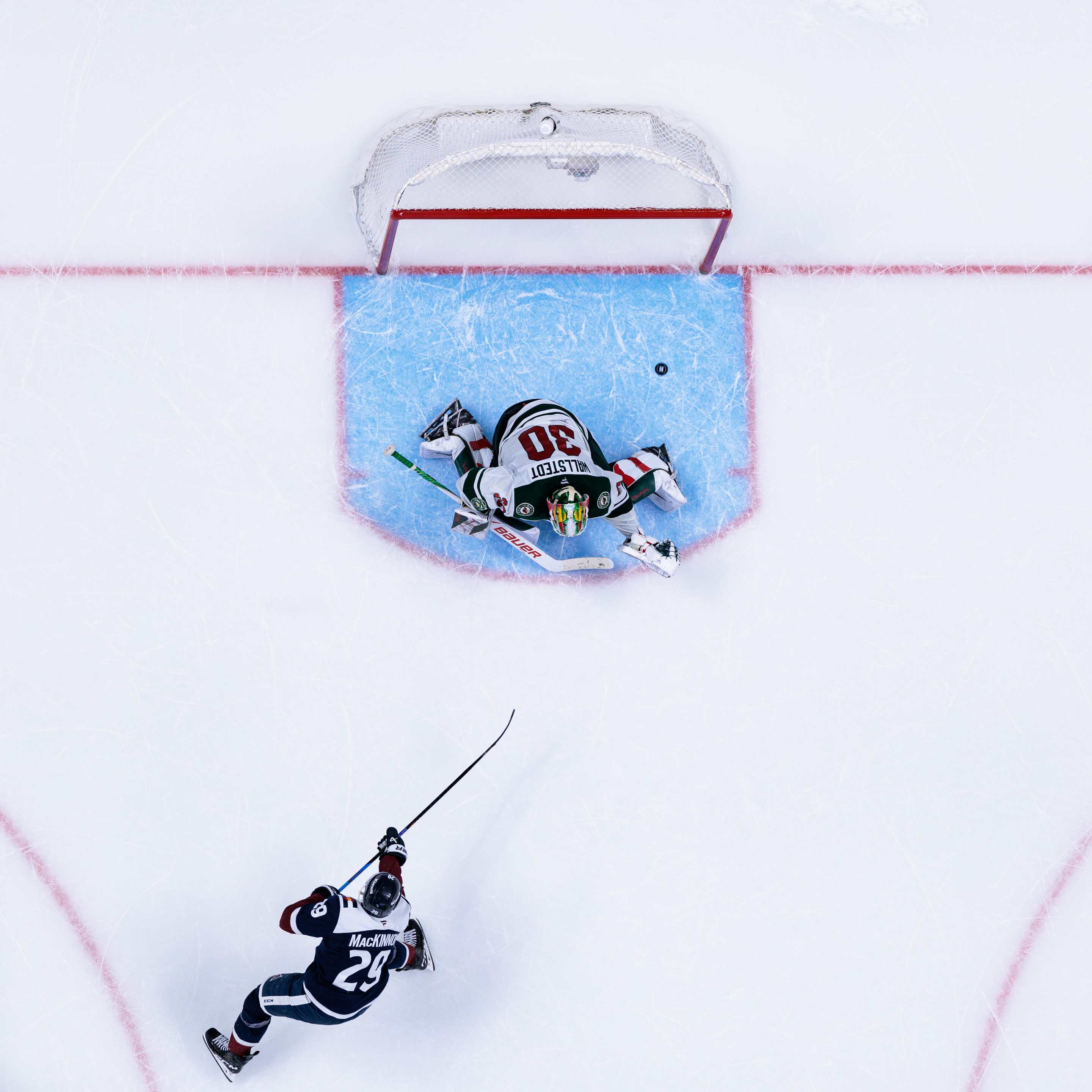 Nathan MacKinnon #29 of the Colorado Avalanche scores a goal during a shootout after overtime to win the game against the Minnesota Wild