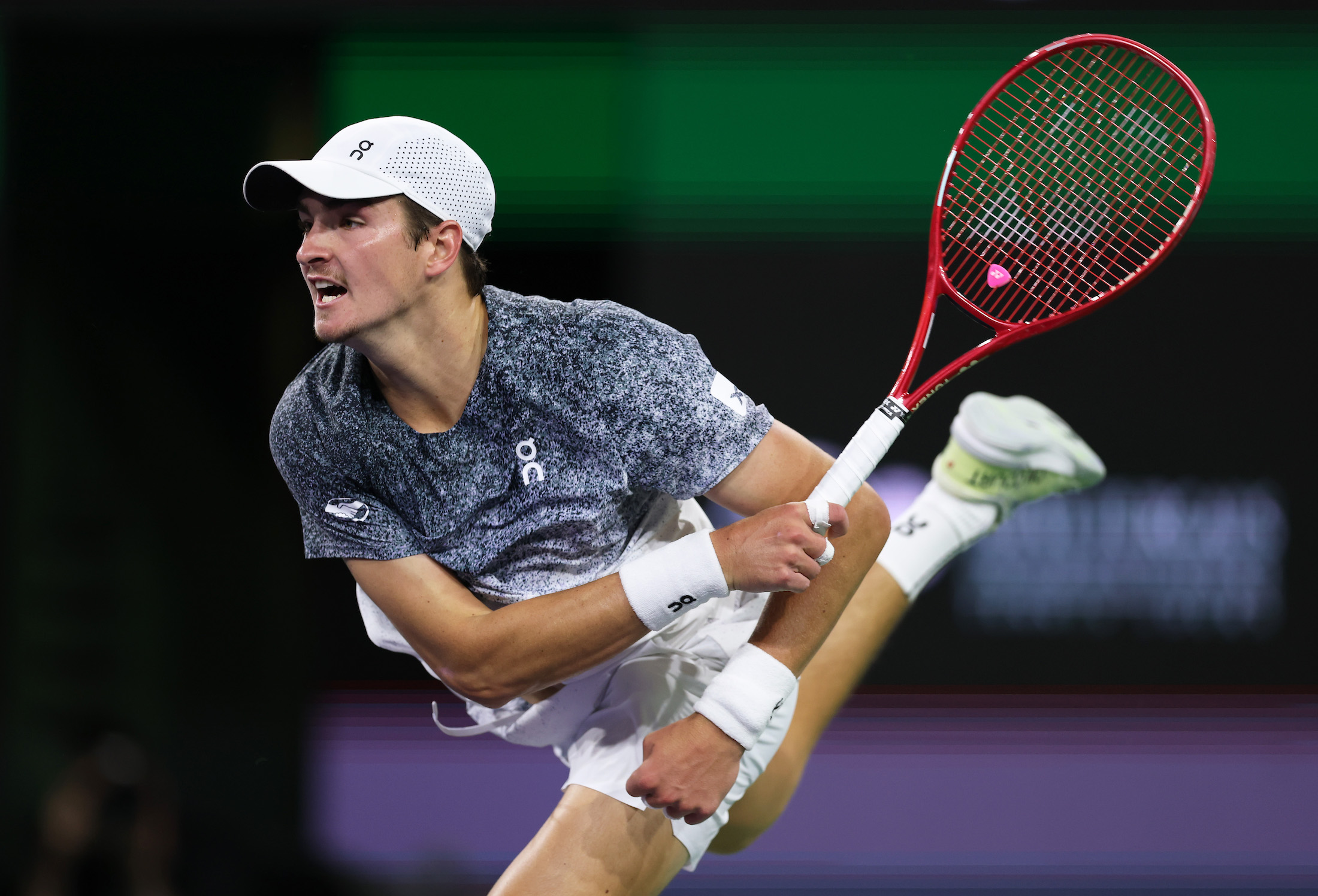 Joao Fonseca of Brazil serves against Jannik Sinner of Italy in their fourth round match of the BNP Paribas Open at Indian Wells Tennis Garden on March 10, 2026 in Indian Wells, California. (Photo by Clive Brunskill/Getty Images)