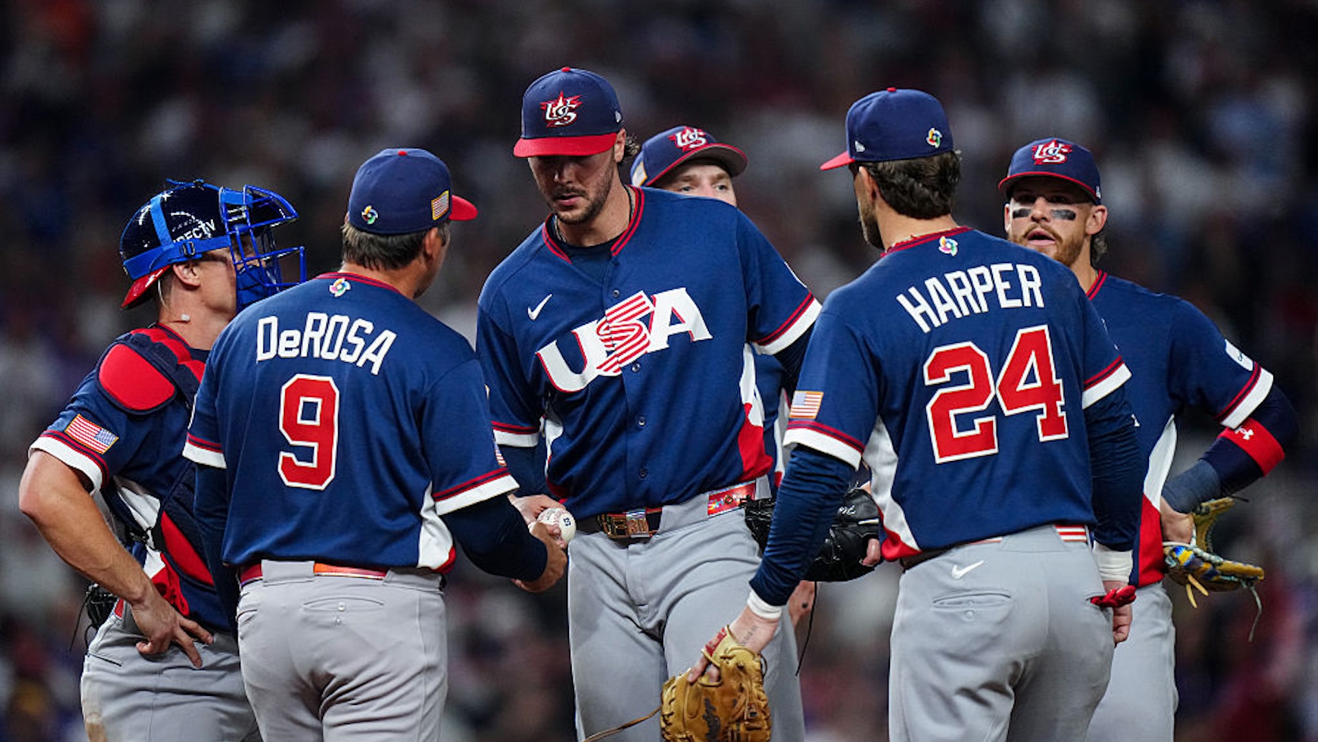 Manager Mark DeRosa #9 takes the game ball from Paul Skenes #30 of Team USA during the 2026 World Baseball Classic WBC game
