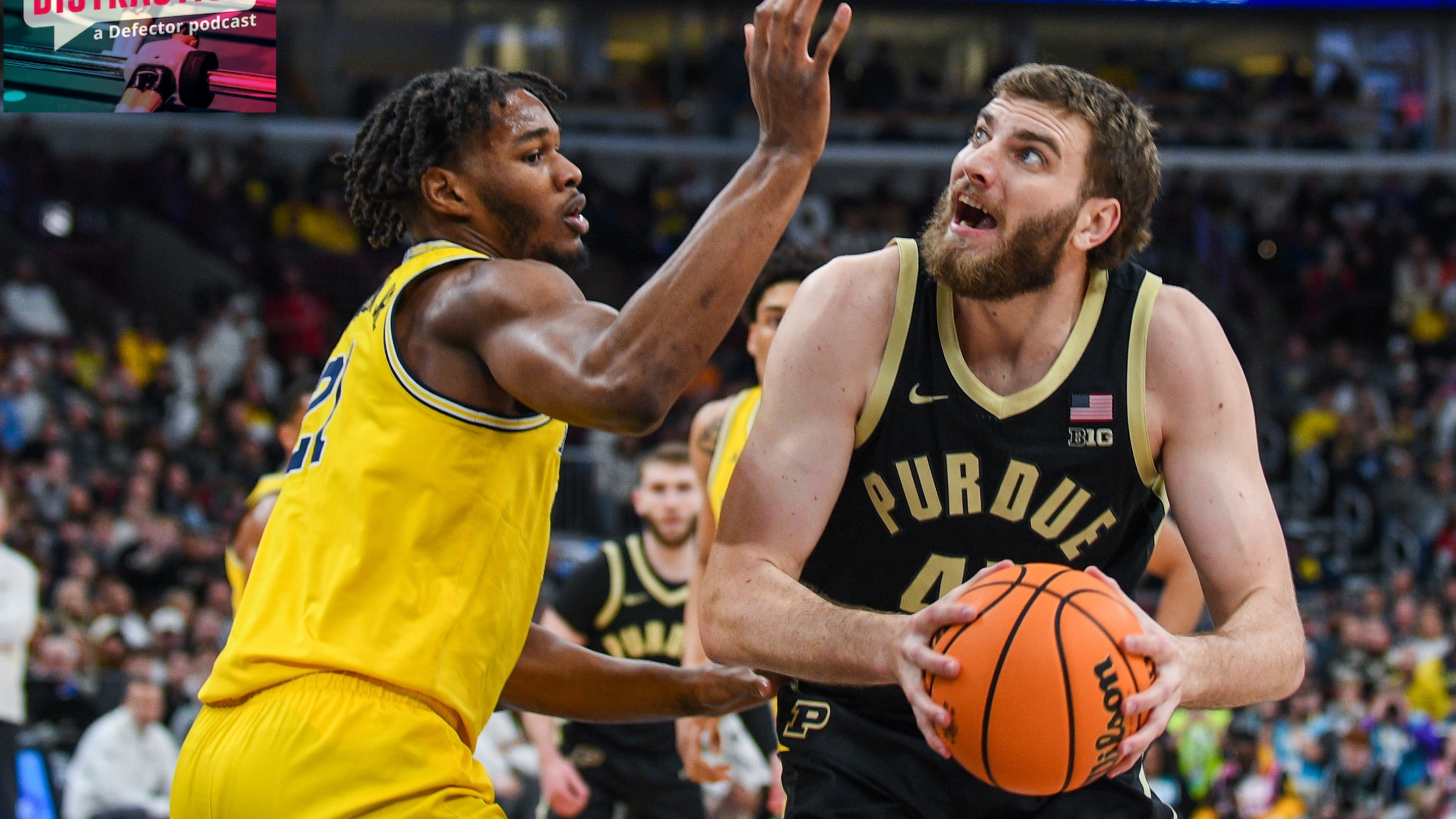 Oscar Cluff #45 of the Purdue Boilermakers looks for a shot against Morez Johnson Jr. #21 of the Michigan Wolverines during the first half of the Big Ten Men's Basketball Tournament Championship game on March 15, 2026.