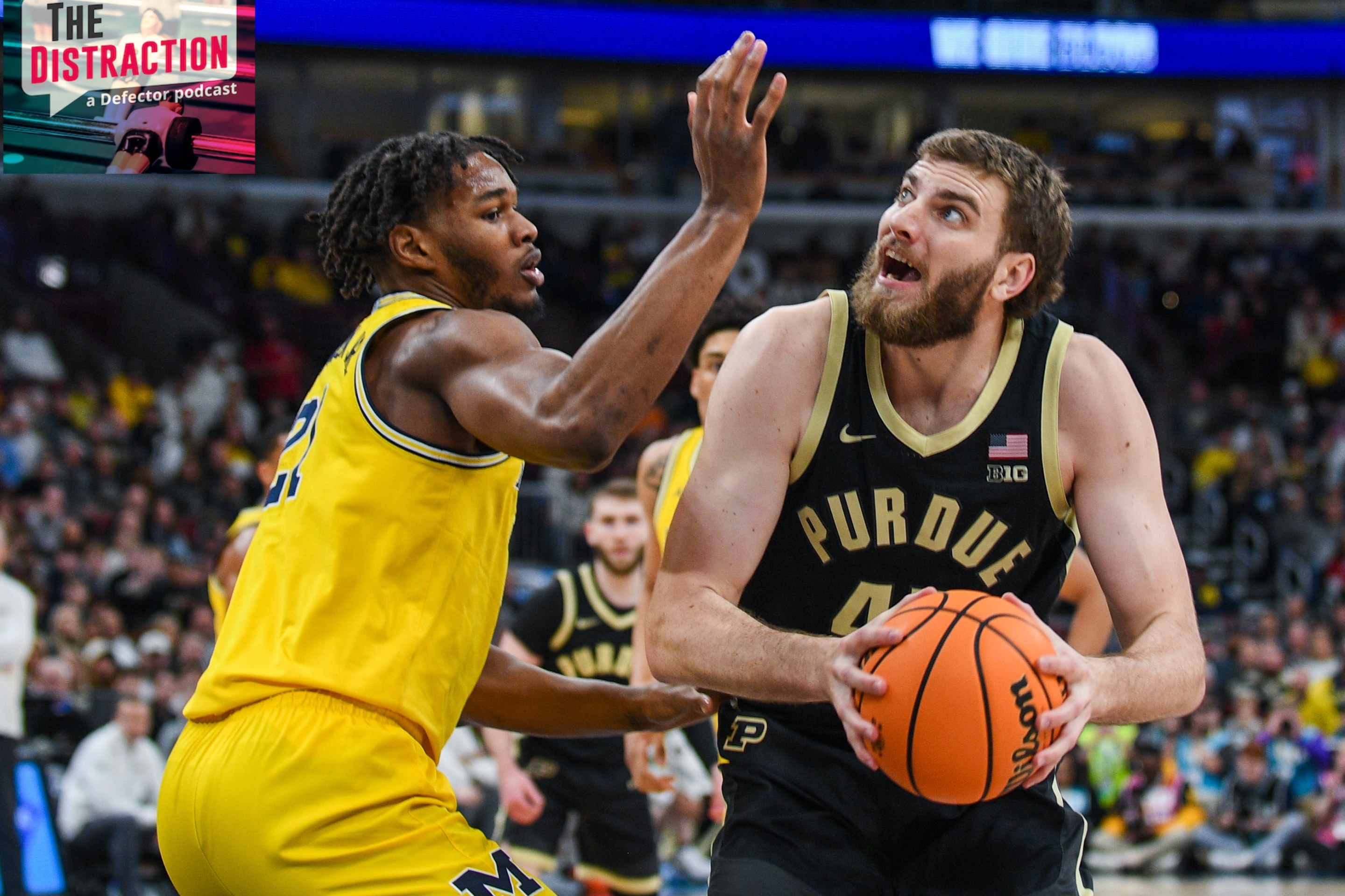 Oscar Cluff #45 of the Purdue Boilermakers looks for a shot against Morez Johnson Jr. #21 of the Michigan Wolverines during the first half of the Big Ten Men's Basketball Tournament Championship game on March 15, 2026.