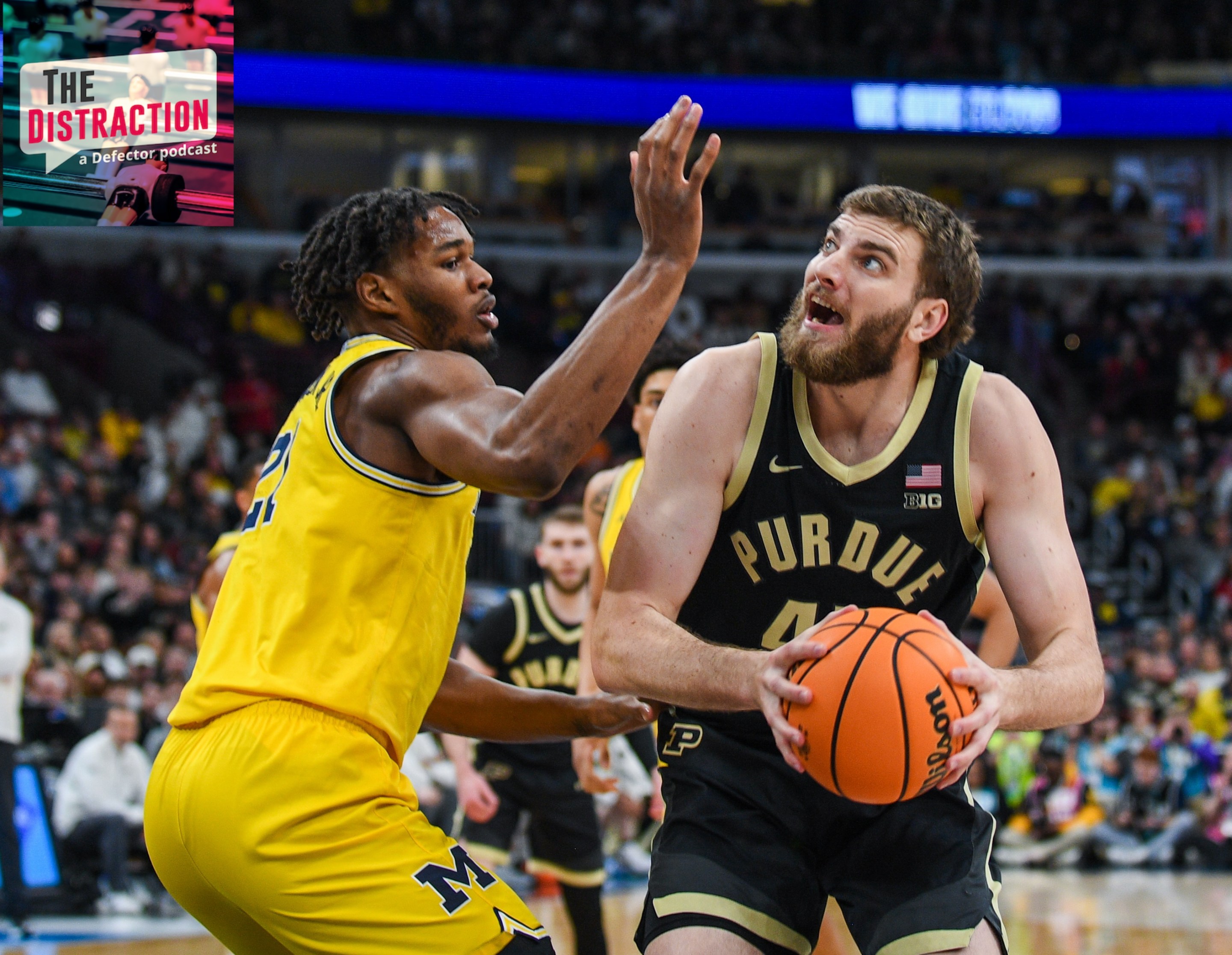 Oscar Cluff #45 of the Purdue Boilermakers looks for a shot against Morez Johnson Jr. #21 of the Michigan Wolverines during the first half of the Big Ten Men's Basketball Tournament Championship game on March 15, 2026.