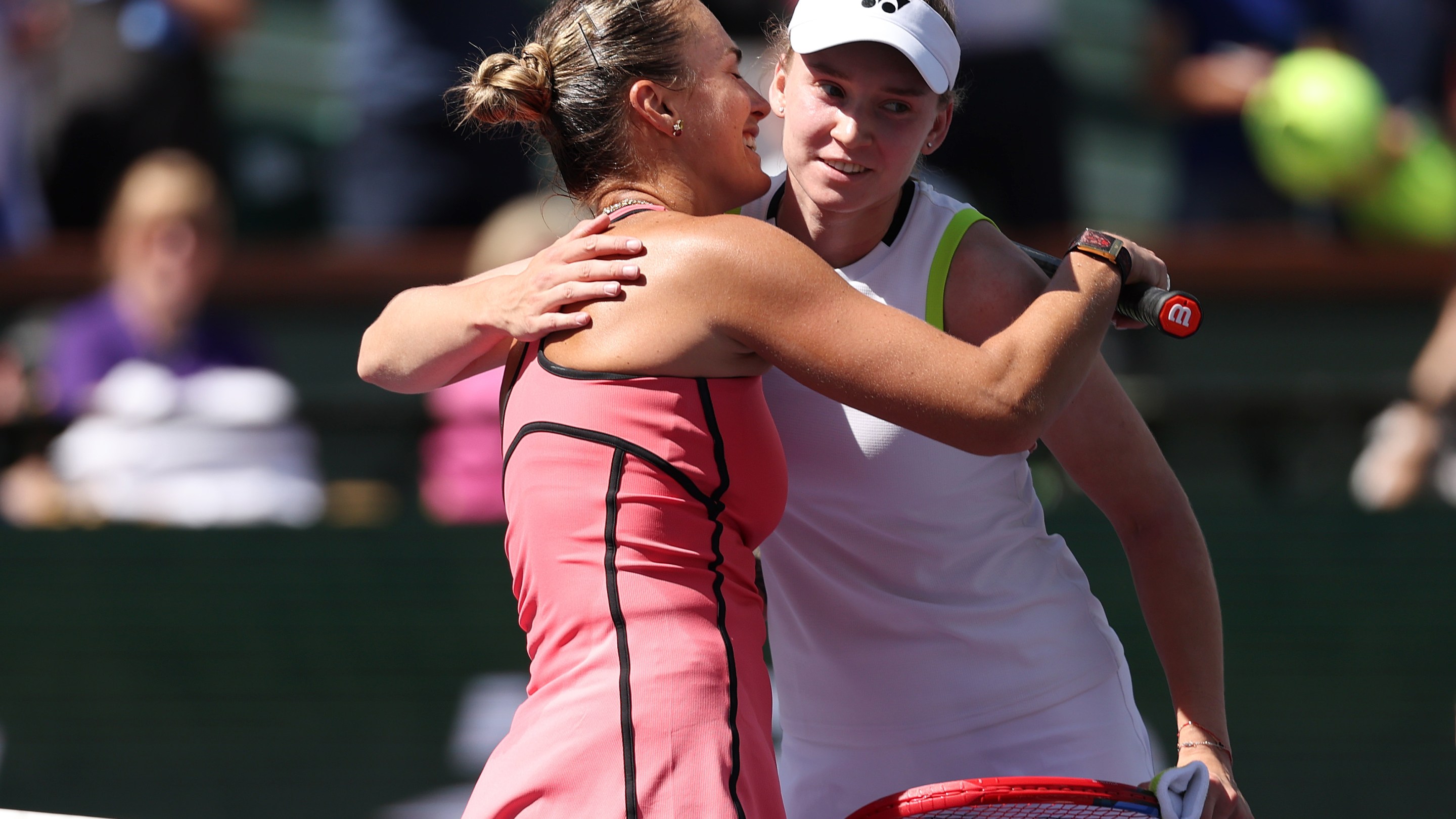 Aryna Sabalenka, left, hugs Elena Rybakina of Kazakhstan after winning their Women's Singles Finals match