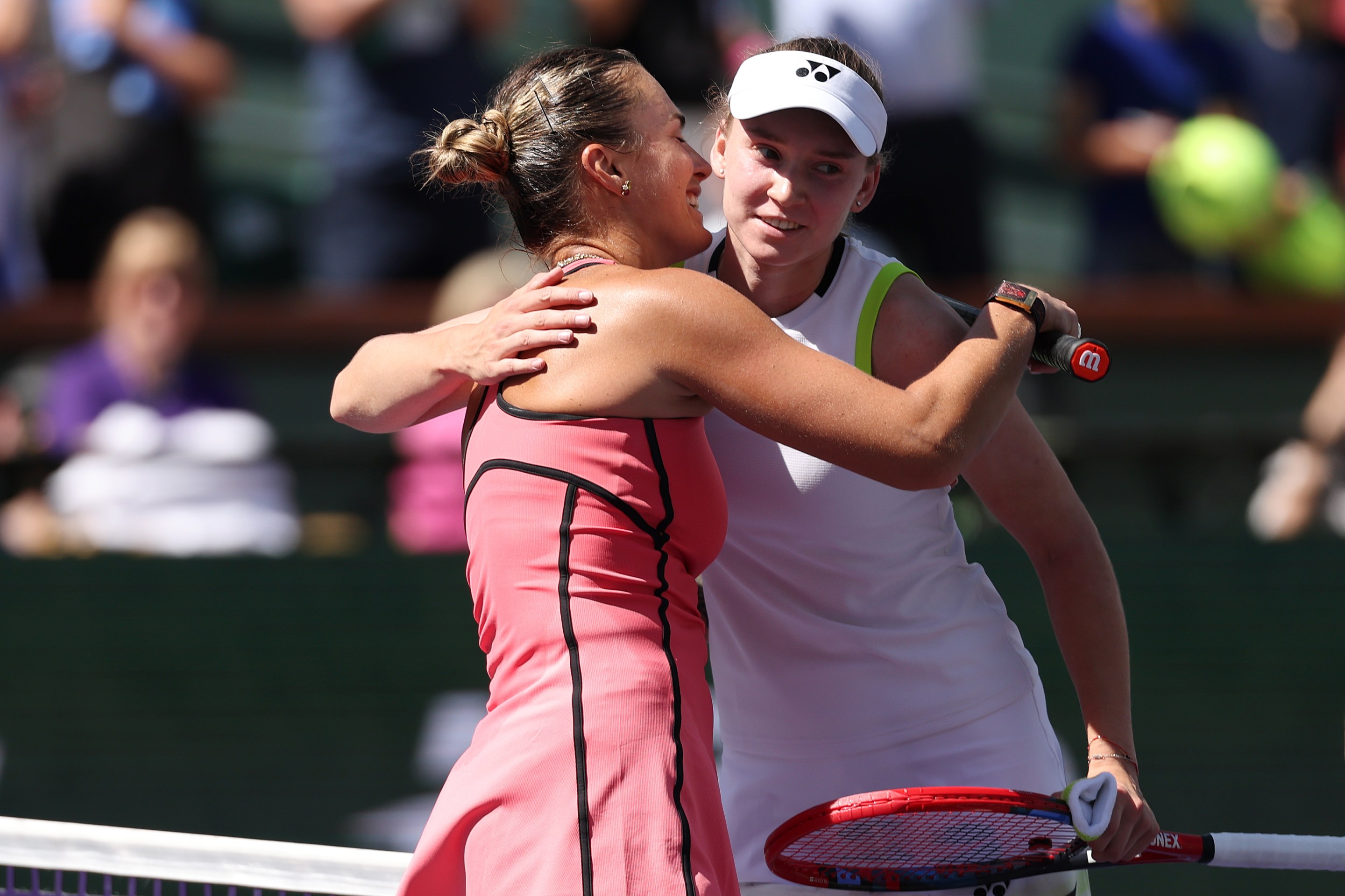 Aryna Sabalenka, left, hugs Elena Rybakina of Kazakhstan after winning their Women's Singles Finals match