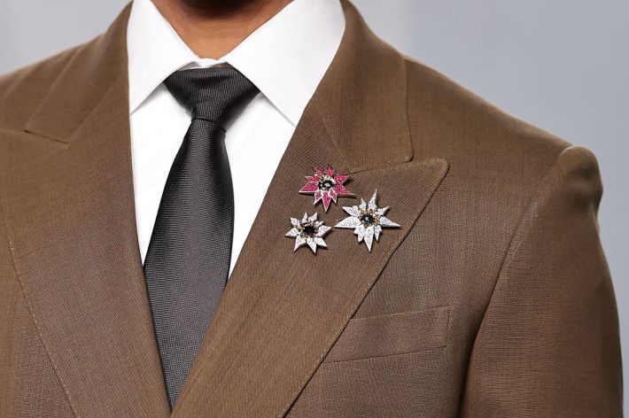 close up of three star shaped brooches
