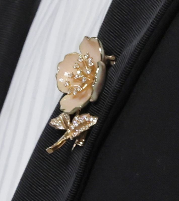 close up of a delicate brooch made