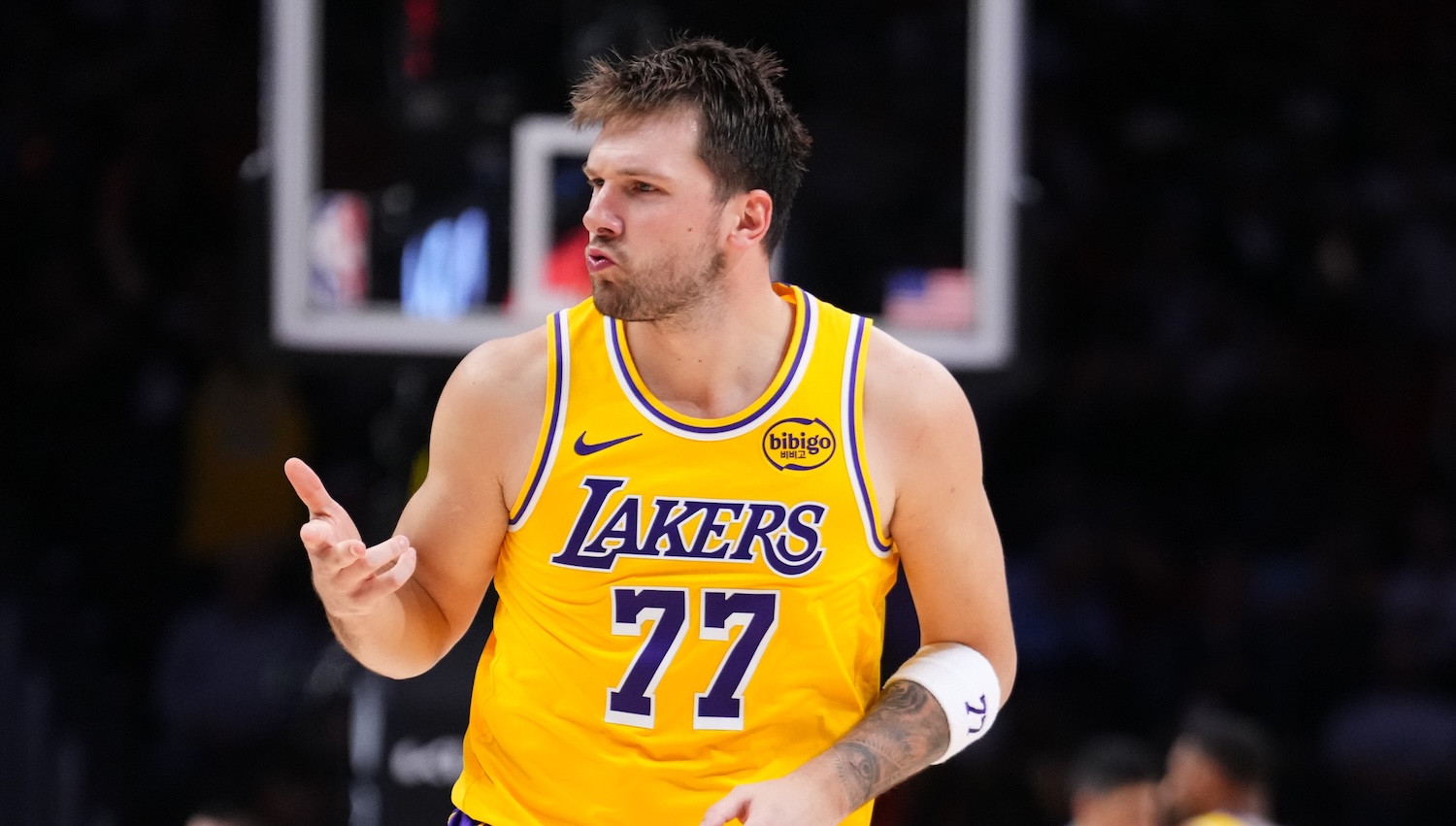 MIAMI, FLORIDA - MARCH 19: Luka Doncic #77 of the Los Angeles Lakers reacts after scoring a three-pointer against the Miami Heat during the third quarter at Kaseya Center on March 19, 2026 in Miami, Florida. NOTE TO USER: User expressly acknowledges and agrees that, by downloading and or using this photograph, User is consenting to the terms and conditions of the Getty Images License Agreement. (Photo by Rich Storry/Getty Images)