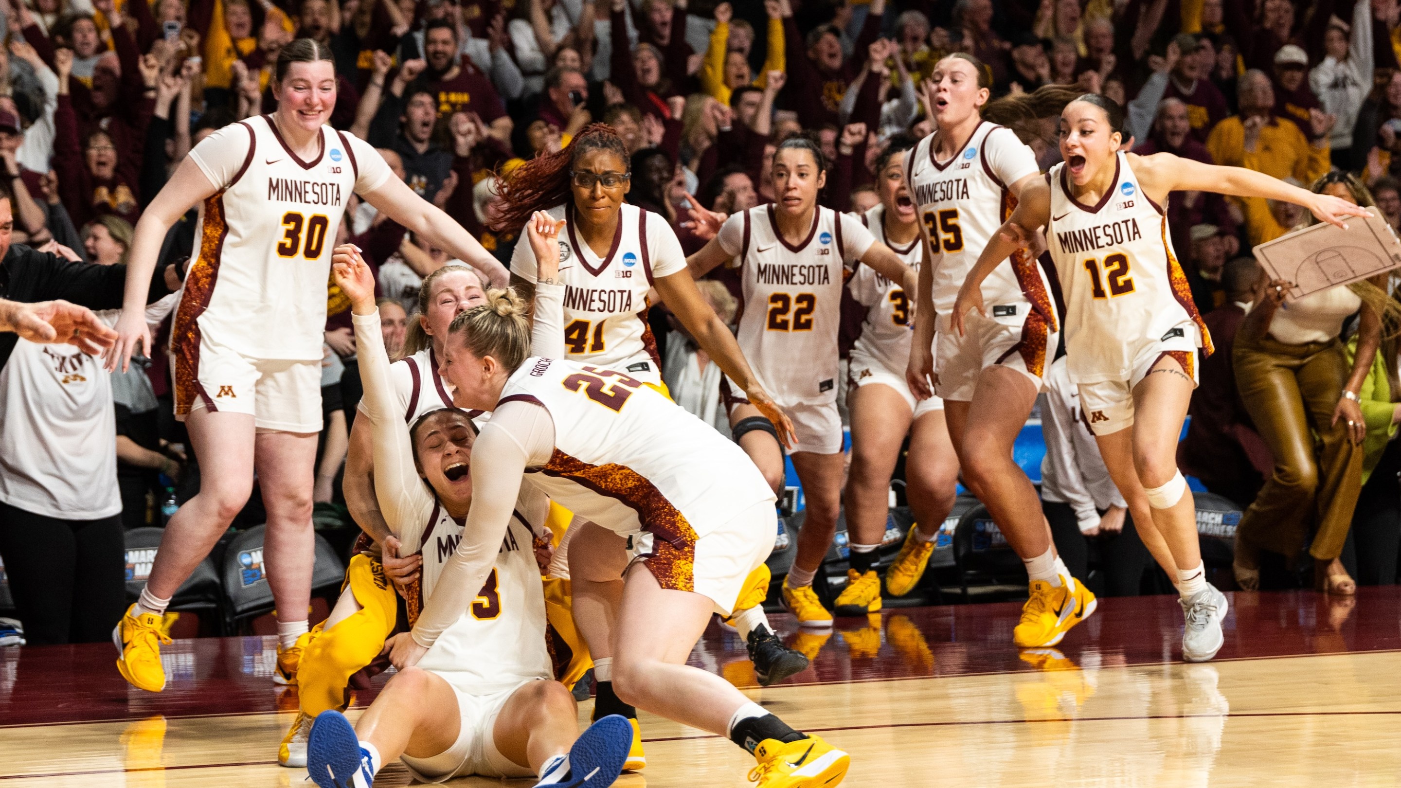 Amaya Battle #3 of the Minnesota Golden Gophers celebrates with her team after making a go-ahead shot against the Ole Miss Rebels in the fourth quarter during a second round game of the 2026 NCAA Women's Basketball Tournament held at Williams Arena on March 22, 2026 in Minneapolis, Minnesota.