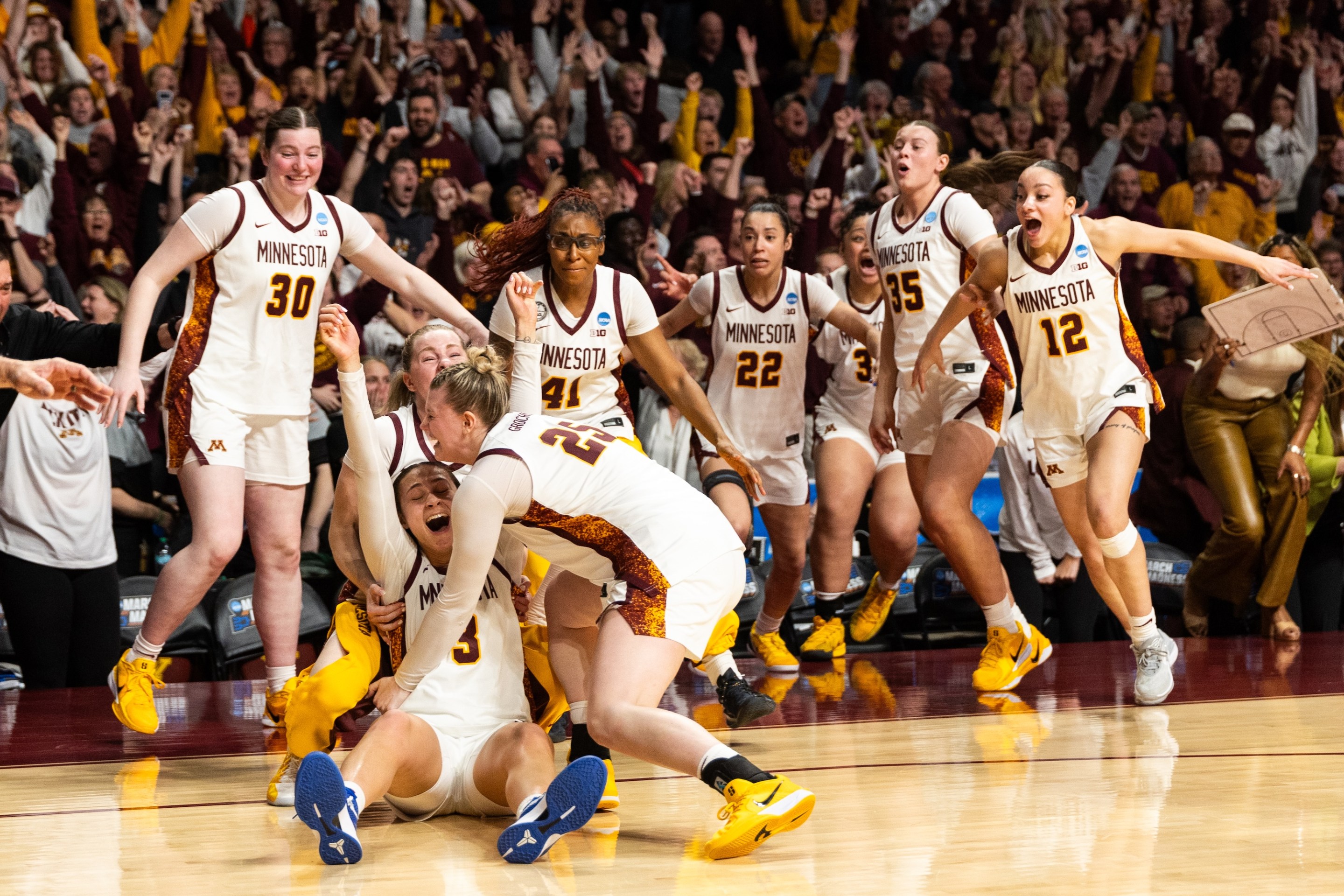 Amaya Battle #3 of the Minnesota Golden Gophers celebrates with her team after making a go-ahead shot against the Ole Miss Rebels in the fourth quarter during a second round game of the 2026 NCAA Women's Basketball Tournament held at Williams Arena on March 22, 2026 in Minneapolis, Minnesota.