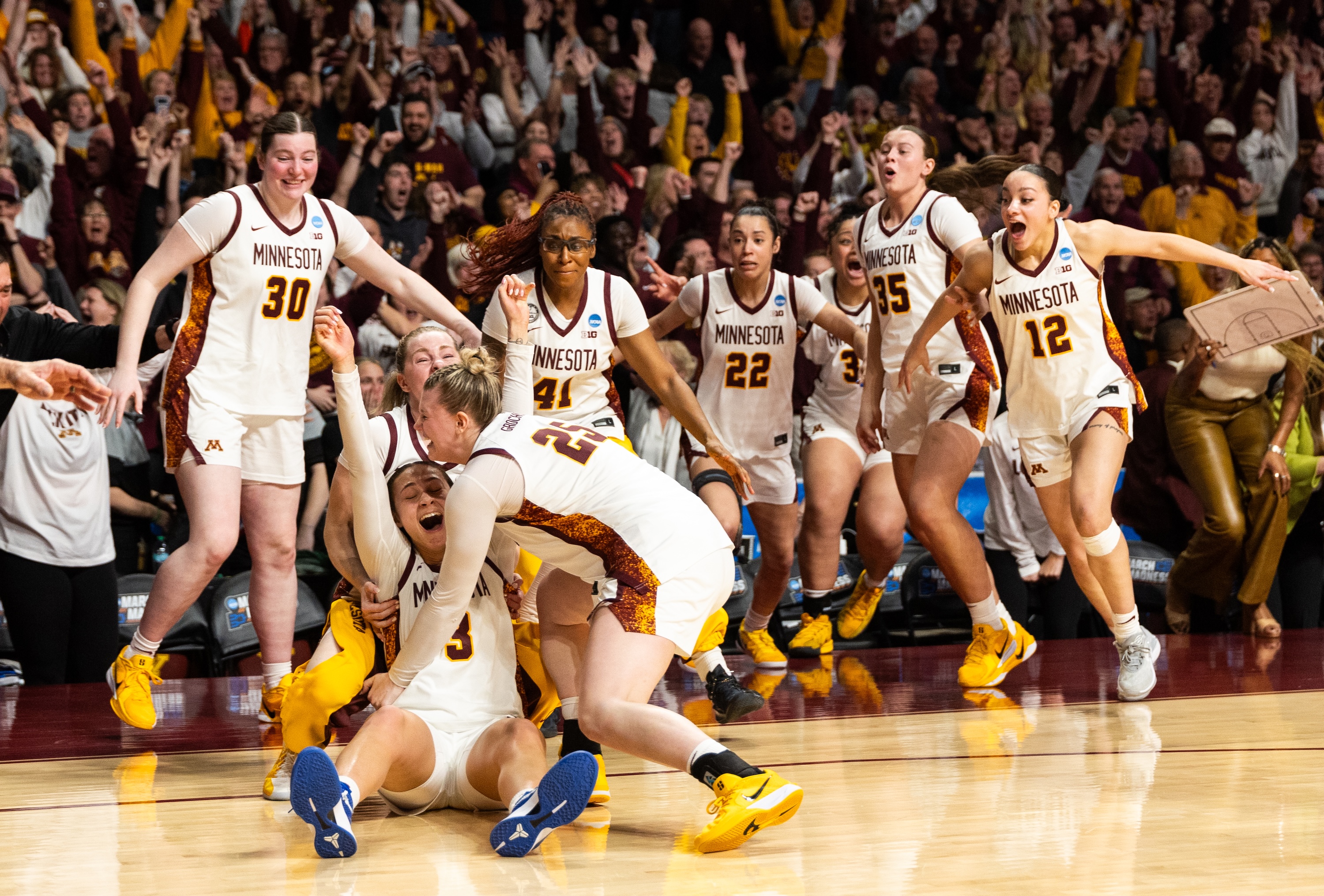 Amaya Battle #3 of the Minnesota Golden Gophers celebrates with her team after making a go-ahead shot against the Ole Miss Rebels in the fourth quarter during a second round game of the 2026 NCAA Women's Basketball Tournament held at Williams Arena on March 22, 2026 in Minneapolis, Minnesota.