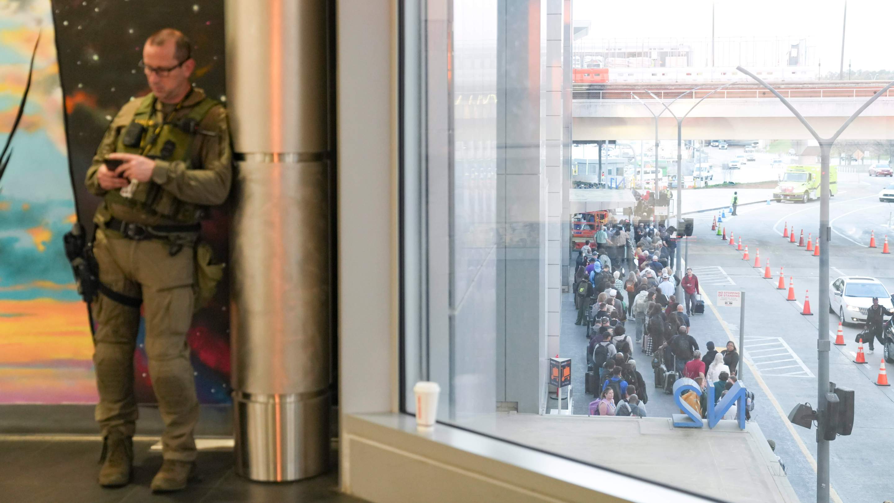 ATLANTA, GEORGIA - MARCH 23: Travelers stand in long lines at Atlanta Hartsfield-Jackson International Airport on March 23, 2026 in Atlanta, Georgia.The travel disruptions continue as hundreds of TSA agents quit or work without pay during a partial government shutdown. U.S. President Donald Trump said ICE agents will be deployed to U.S. airports on Monday, with border czar Tom Homan in charge of the effort.(Photo by Megan Varner/Getty Images)