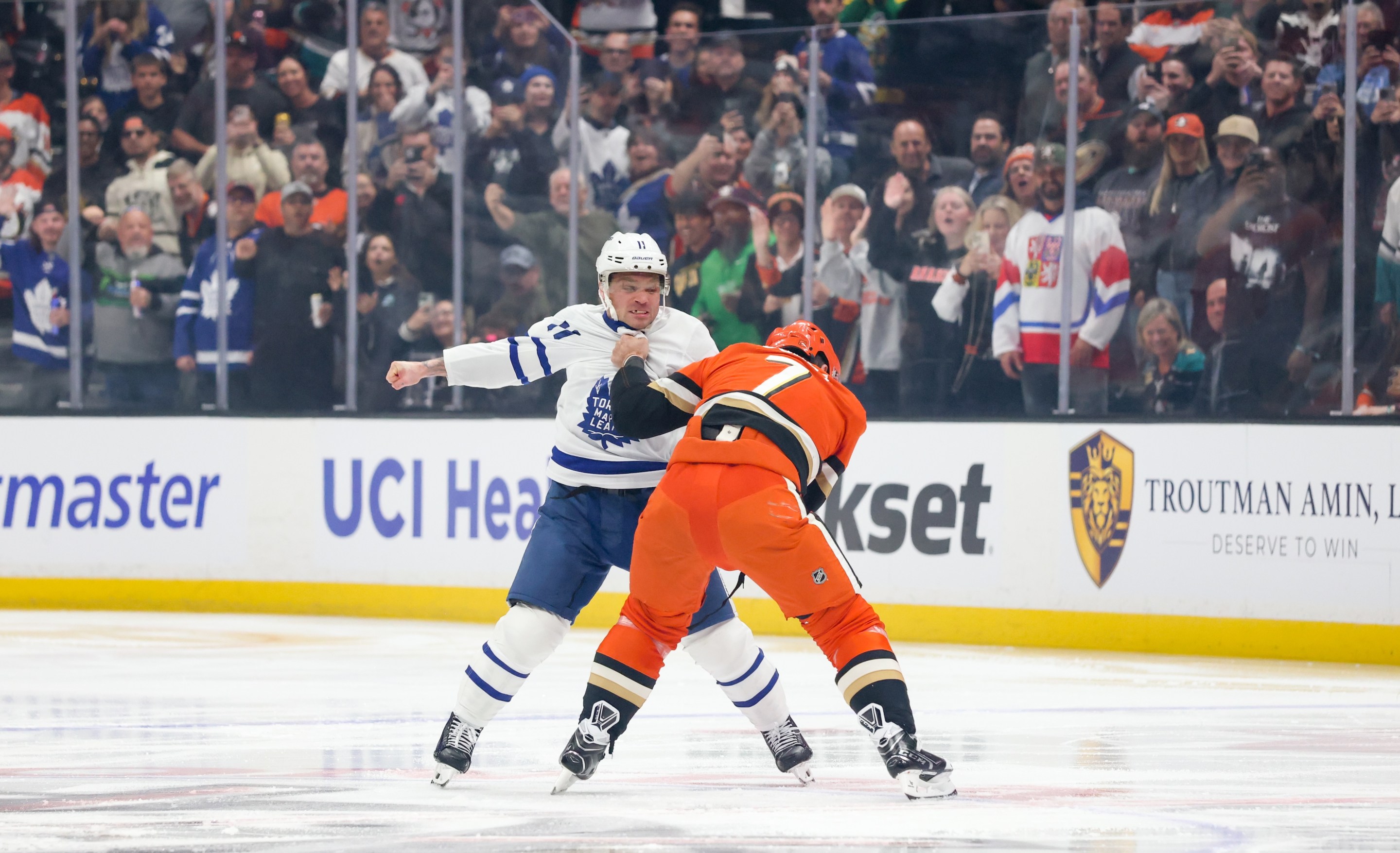 ANAHEIM, CA - MARCH 30: Max Domi #11 of the Toronto Maple Leafs and Radko Gudas #7 of the Anaheim Ducks fight during the first period at Honda Center on March 30, 2026 in Anaheim, California. (Photo by Debora Robinson/NHLI via Getty Images)